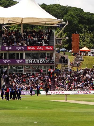 A big crowd fills the pavilion and the Shane Warne Stand at the Utilita Bowl in Southampton during a one-day international, with players walking off the outfield