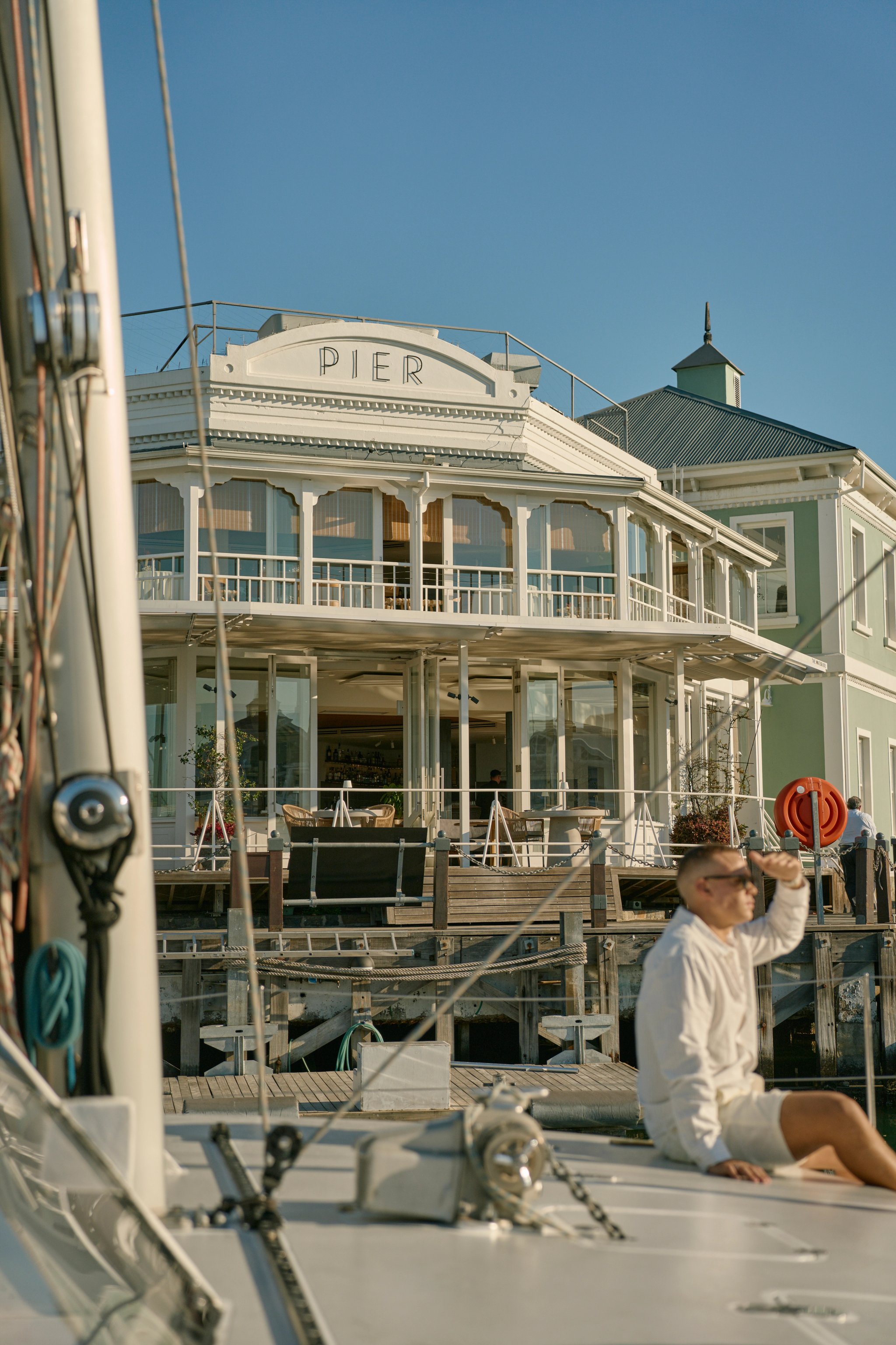 Crew rigging a yacht
