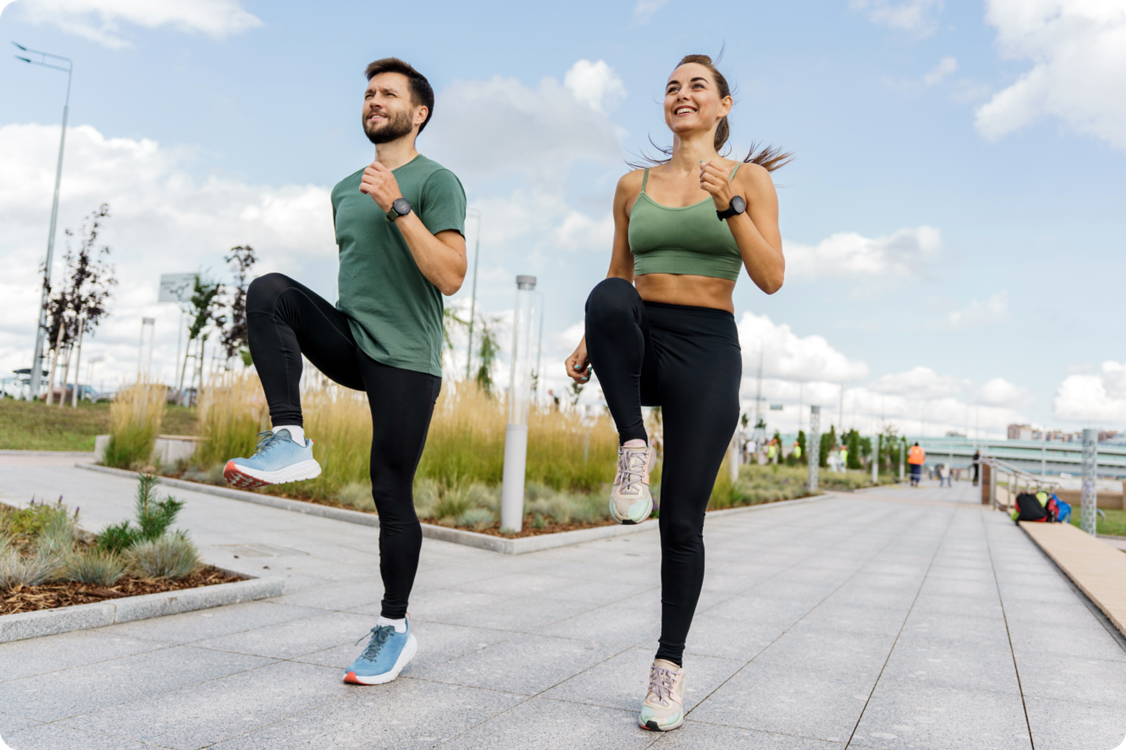 Male and female runner doing the mobility workout in the Exakt Health app.