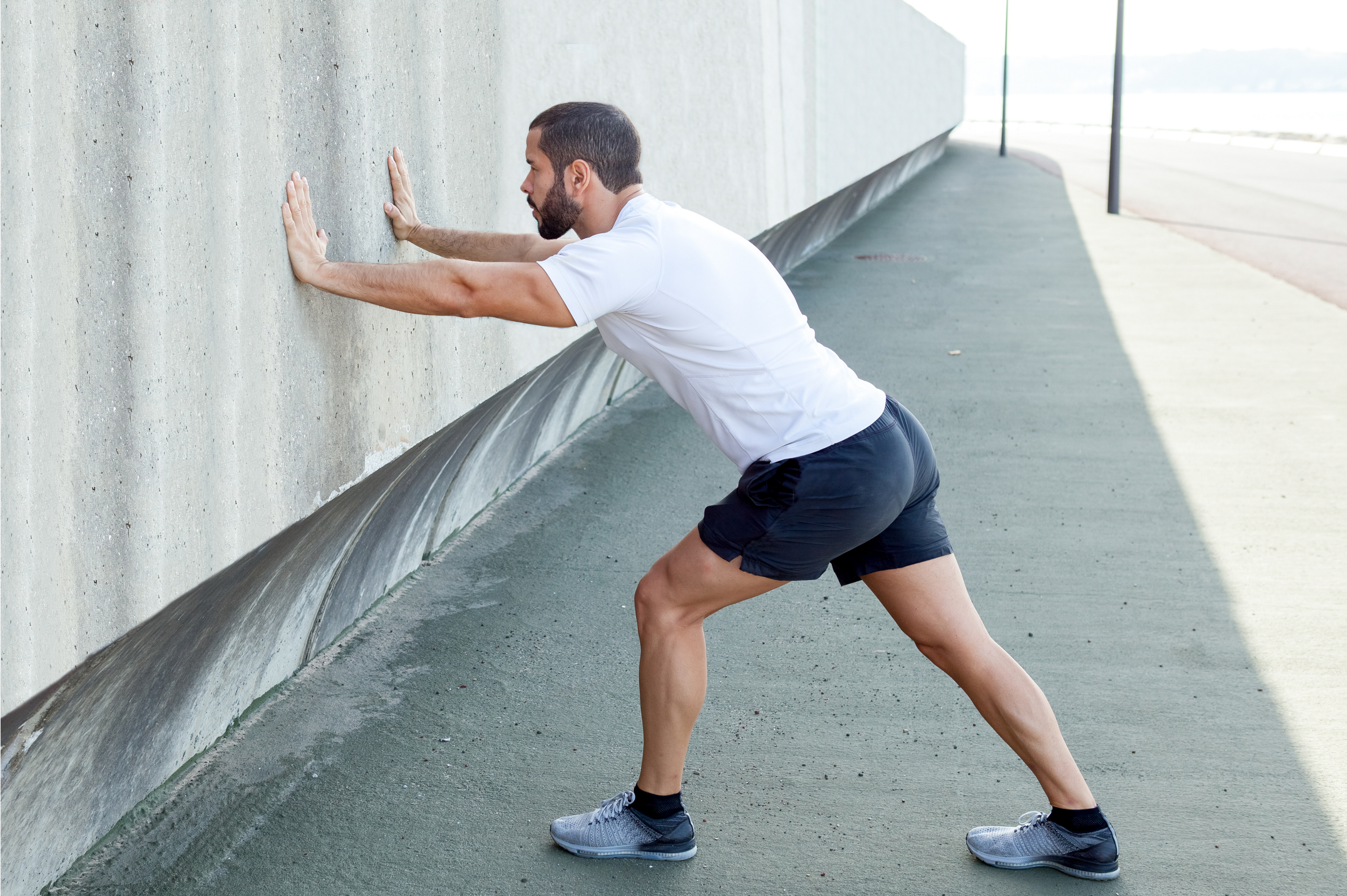 Runner doing a standing calf stretch