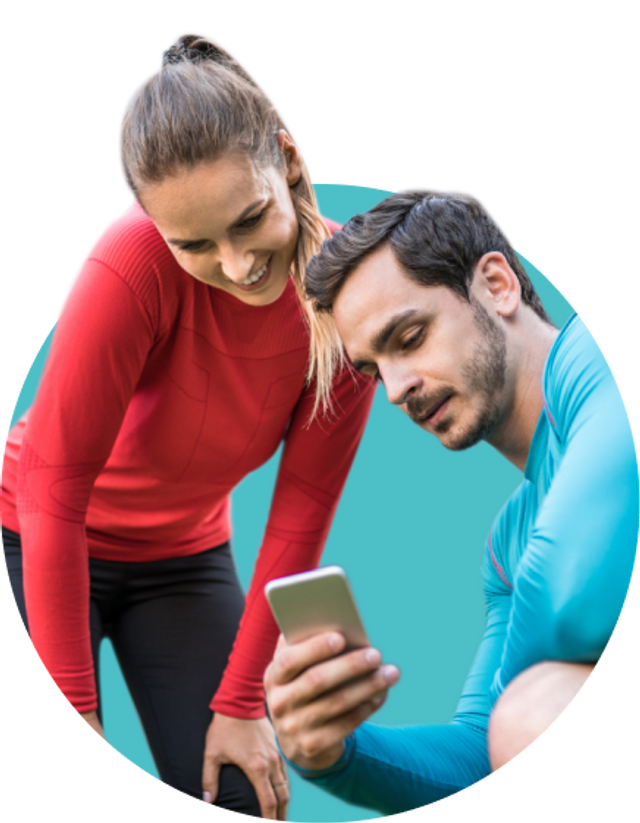 Male and female runner looking at the Exakt Health newsletter on their phone.