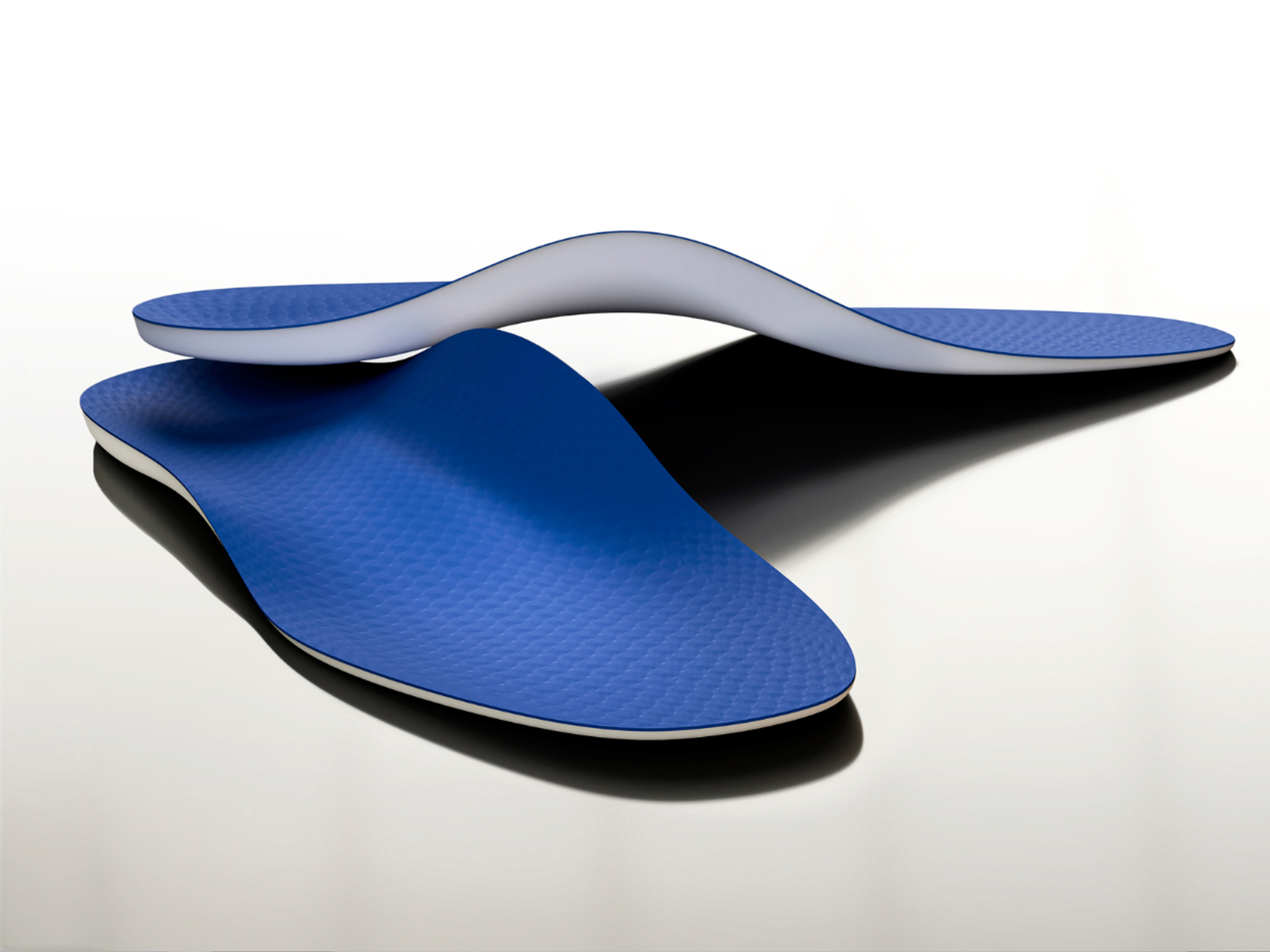 Off-the-shelf insoles come in different heights of arch support. It's usually best to choose one that closely resembles your arch height.