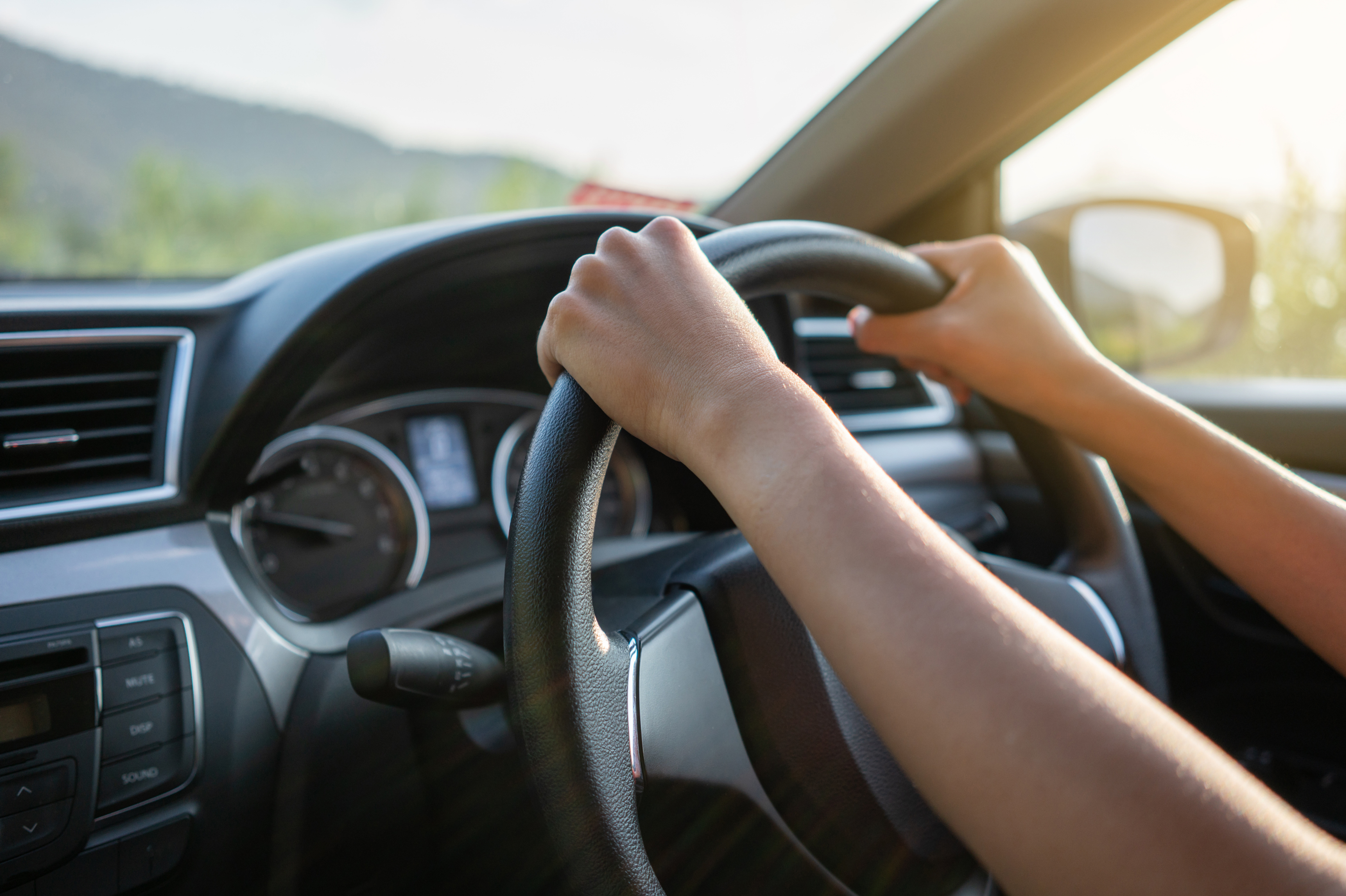 Adjust your driving position so you don't have to strain to reach the steering wheel.