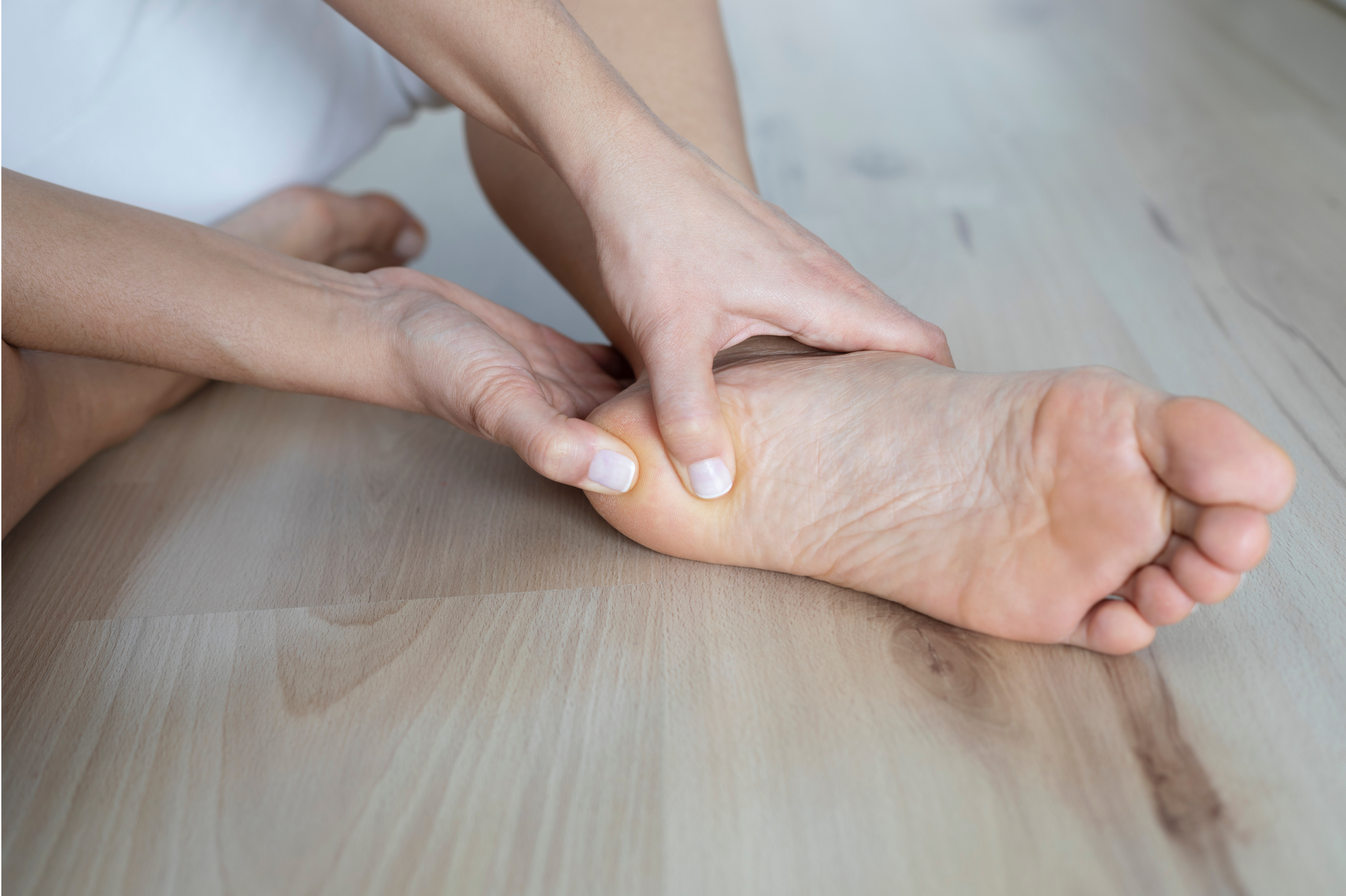 You can tell the difference between plantar fasciitis and heel fat pad pain by pressing under the heel.