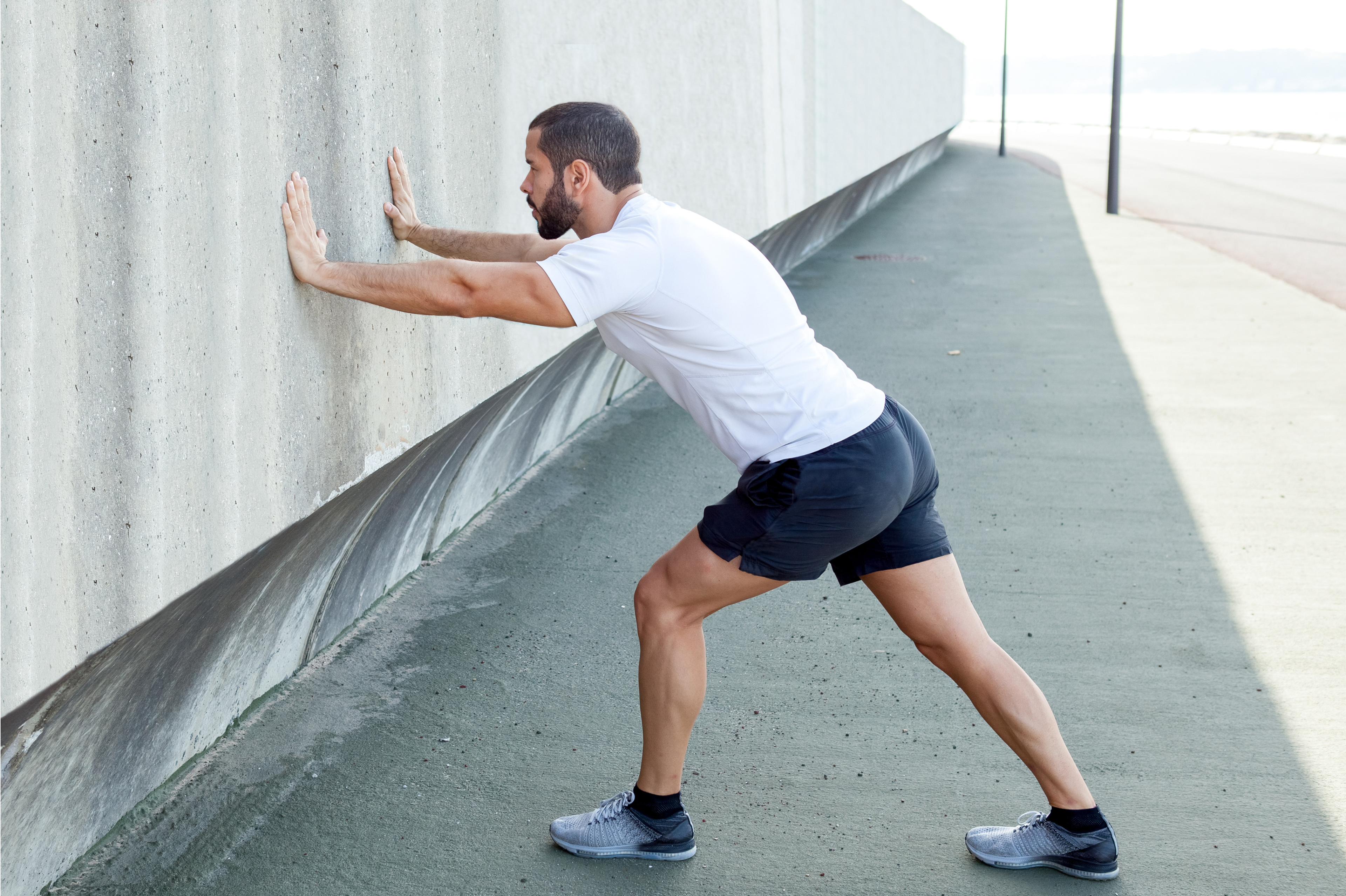 Runner doing a standing calf stretch