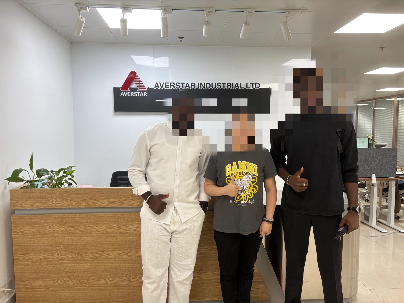 Company staff taking a photo with a Cameroonian customer
