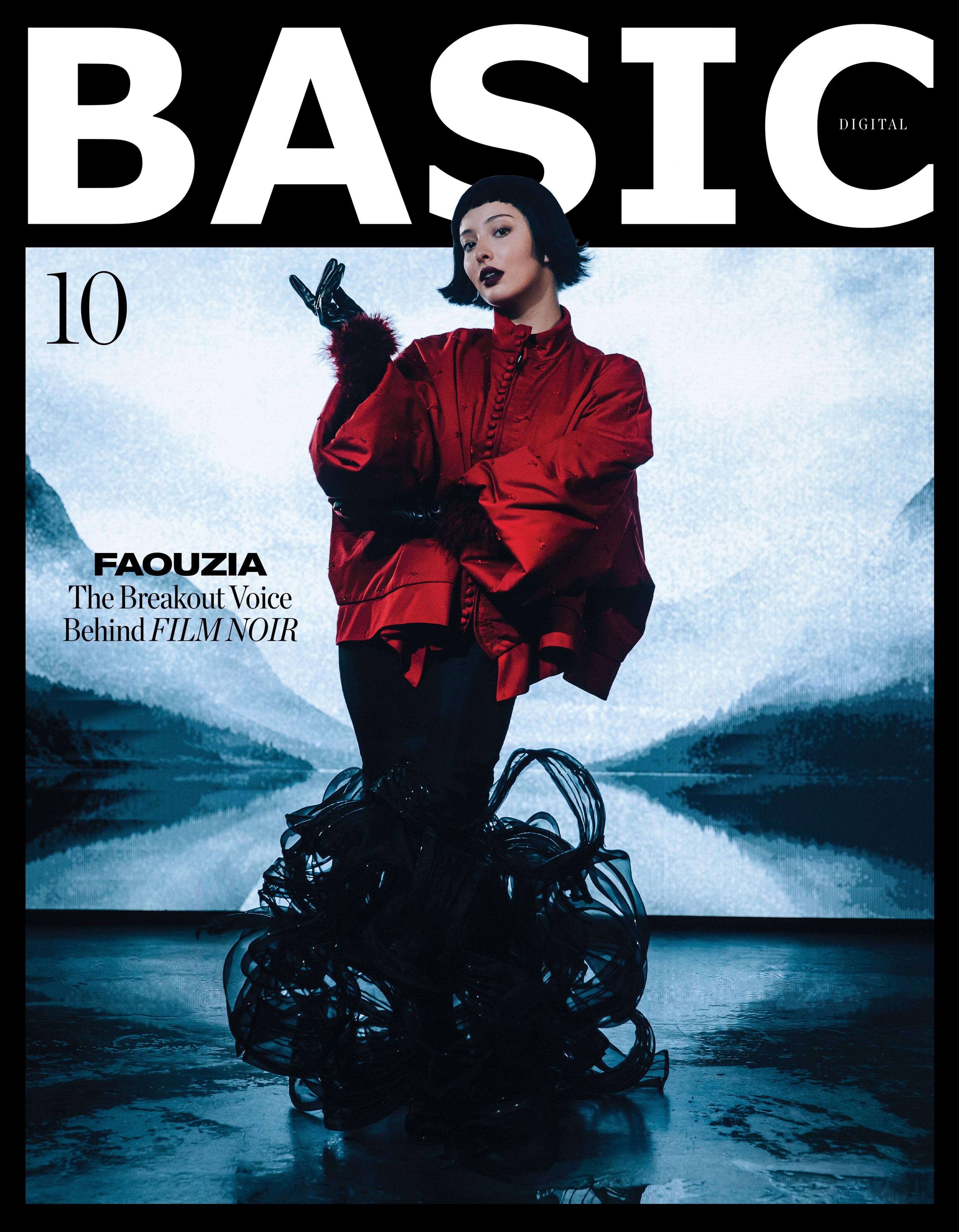 Basic magazine cover of artist wearing red jacket and a black swirl skirt in front of a blue icey background.