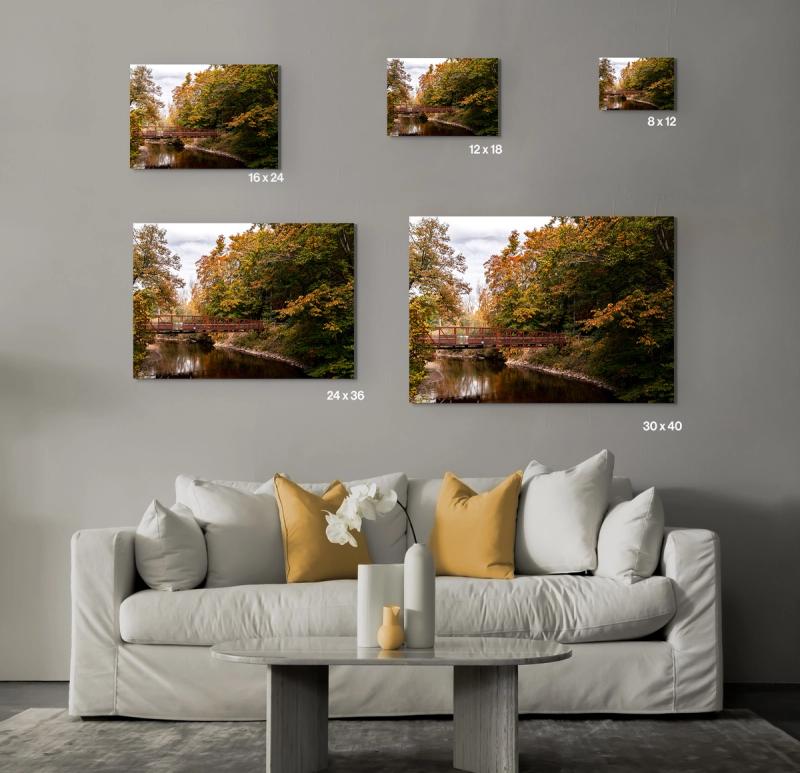 Prints hanging on wall with couch