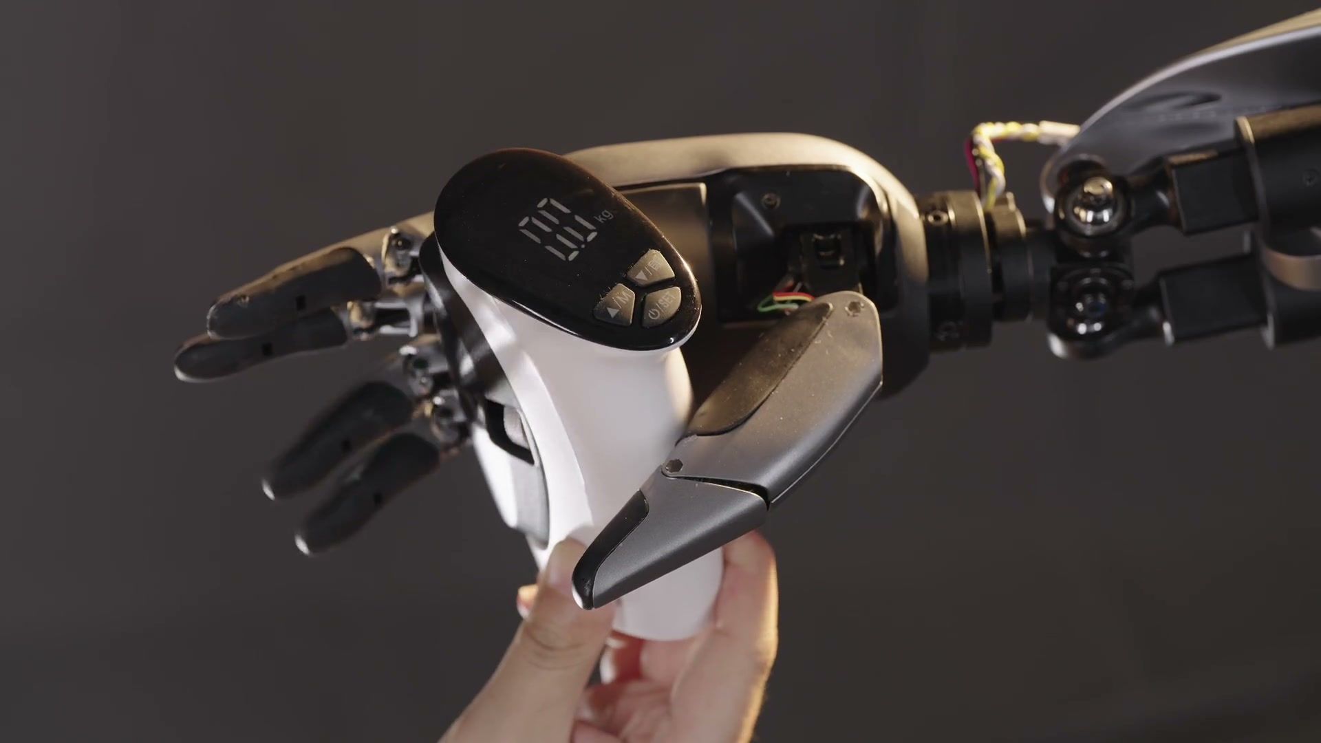 MagicHand S01 dexterous robotic hand grasping a hand-held tool