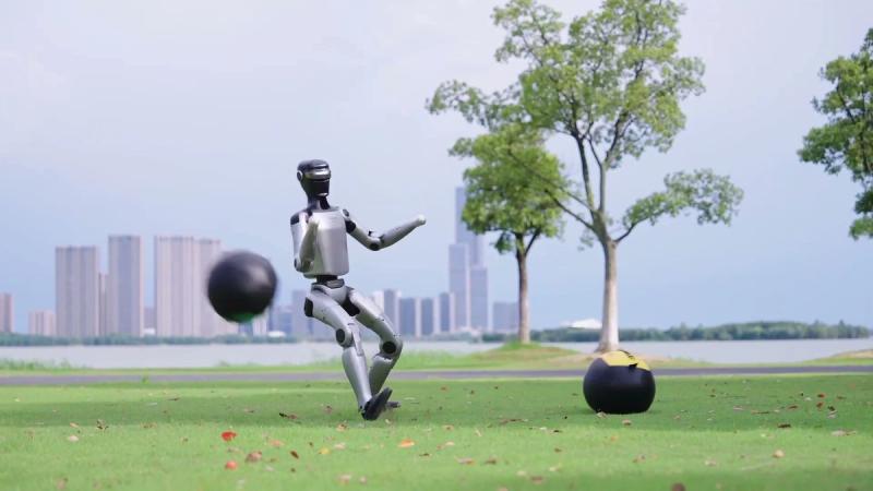 MagicBot Z1 humanoid robot striking a ball on grass