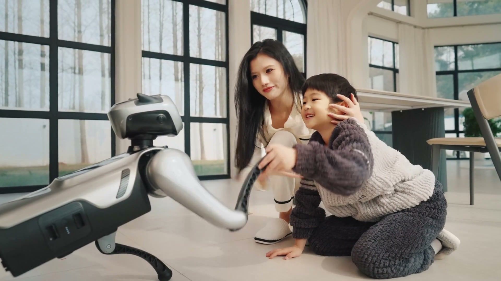 MagicDog quadruped robot interacting with a family at home