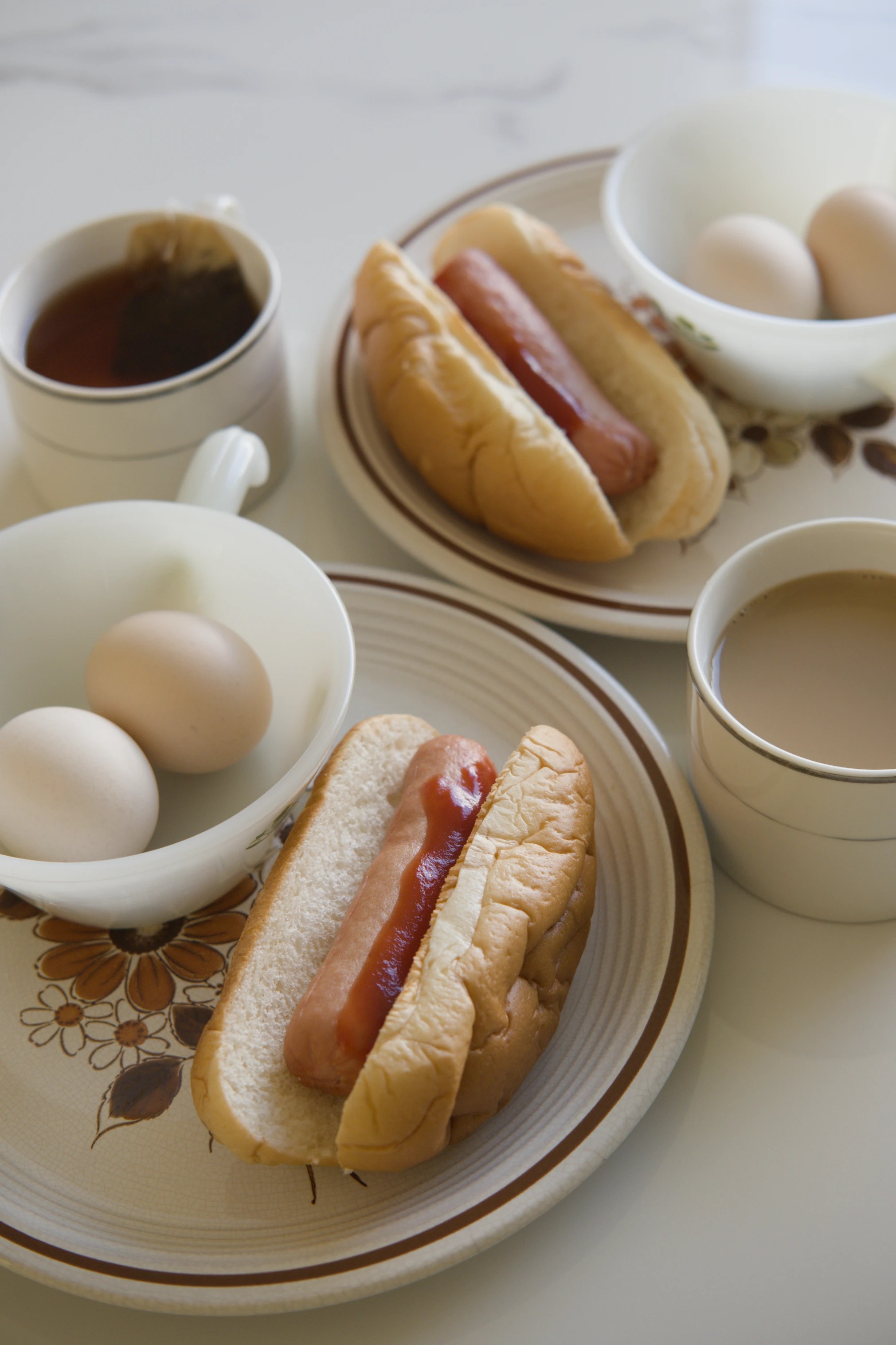 Simple hot dog breakfast with tea and eggs