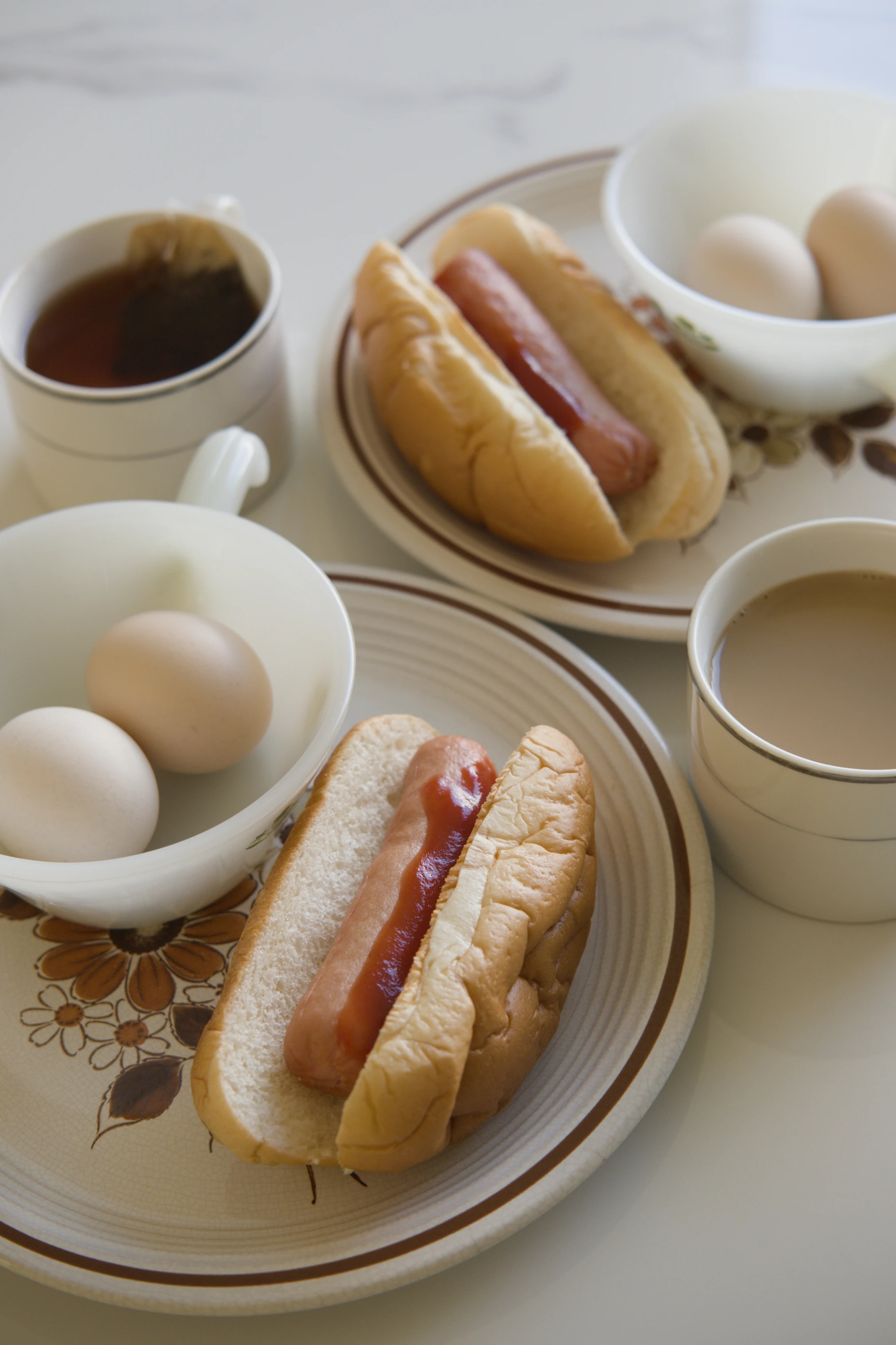 Simple hot dog breakfast with tea and eggs