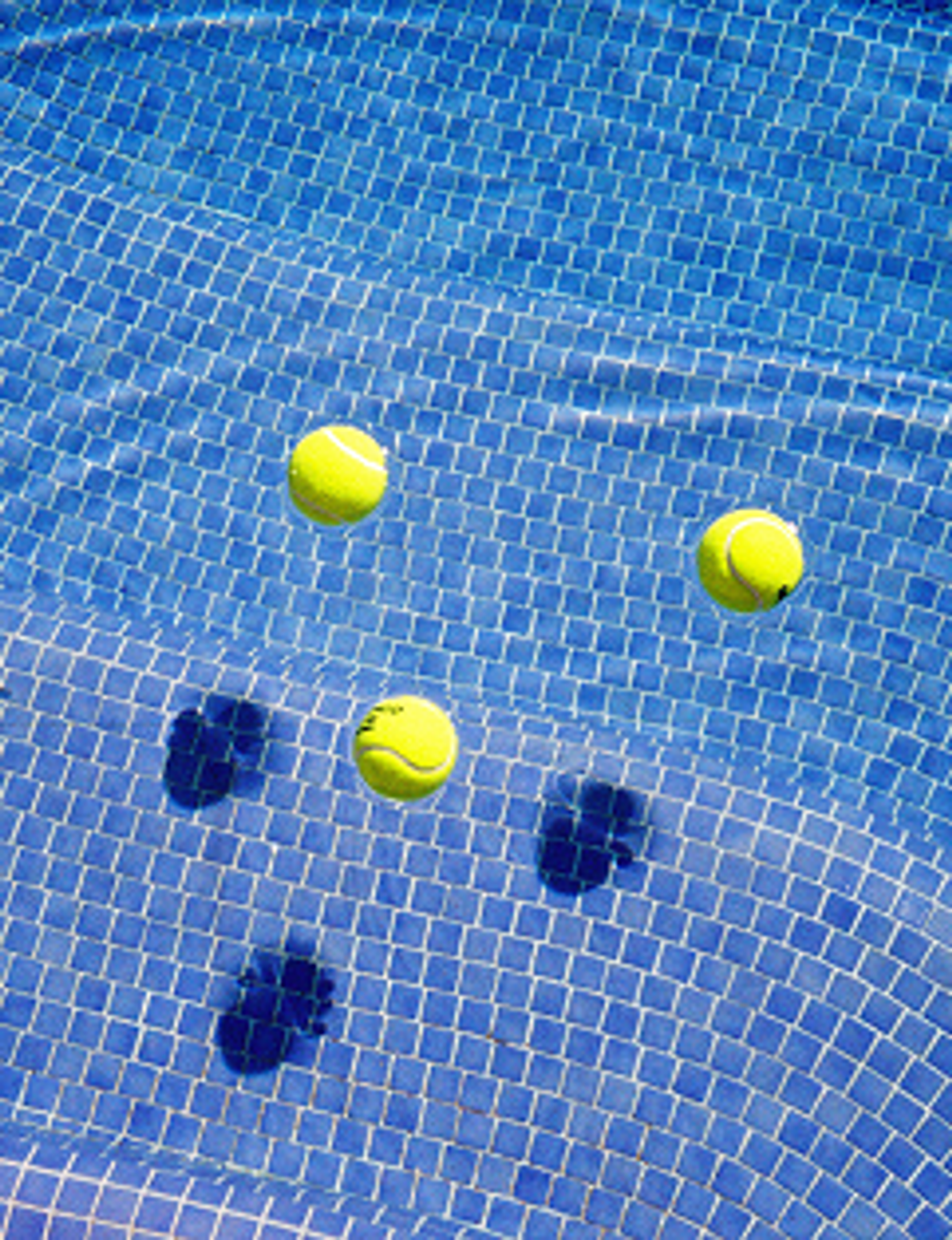 tennis balls by the pool