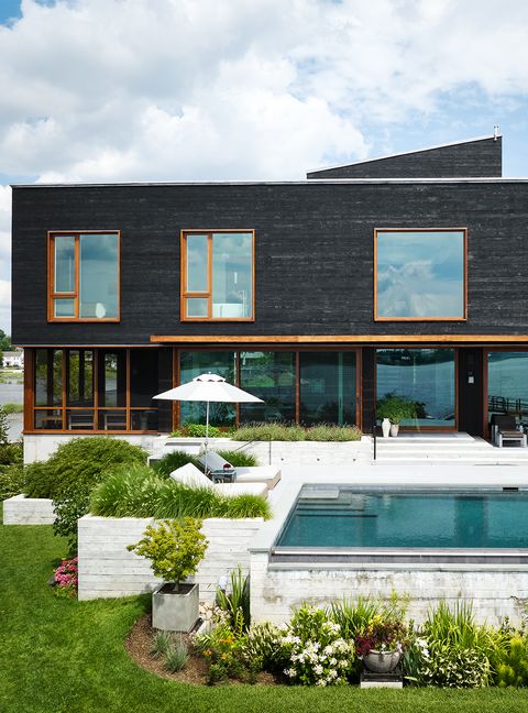 New Construction Waterfront Rear Facade Pool