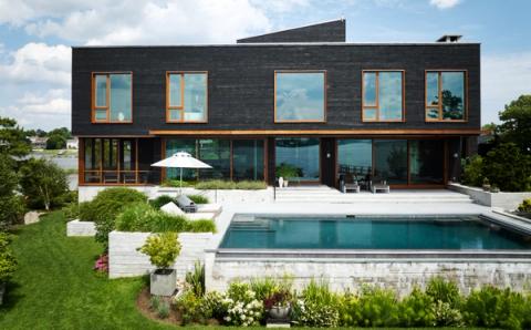 New Construction Waterfront Rear Facade Pool