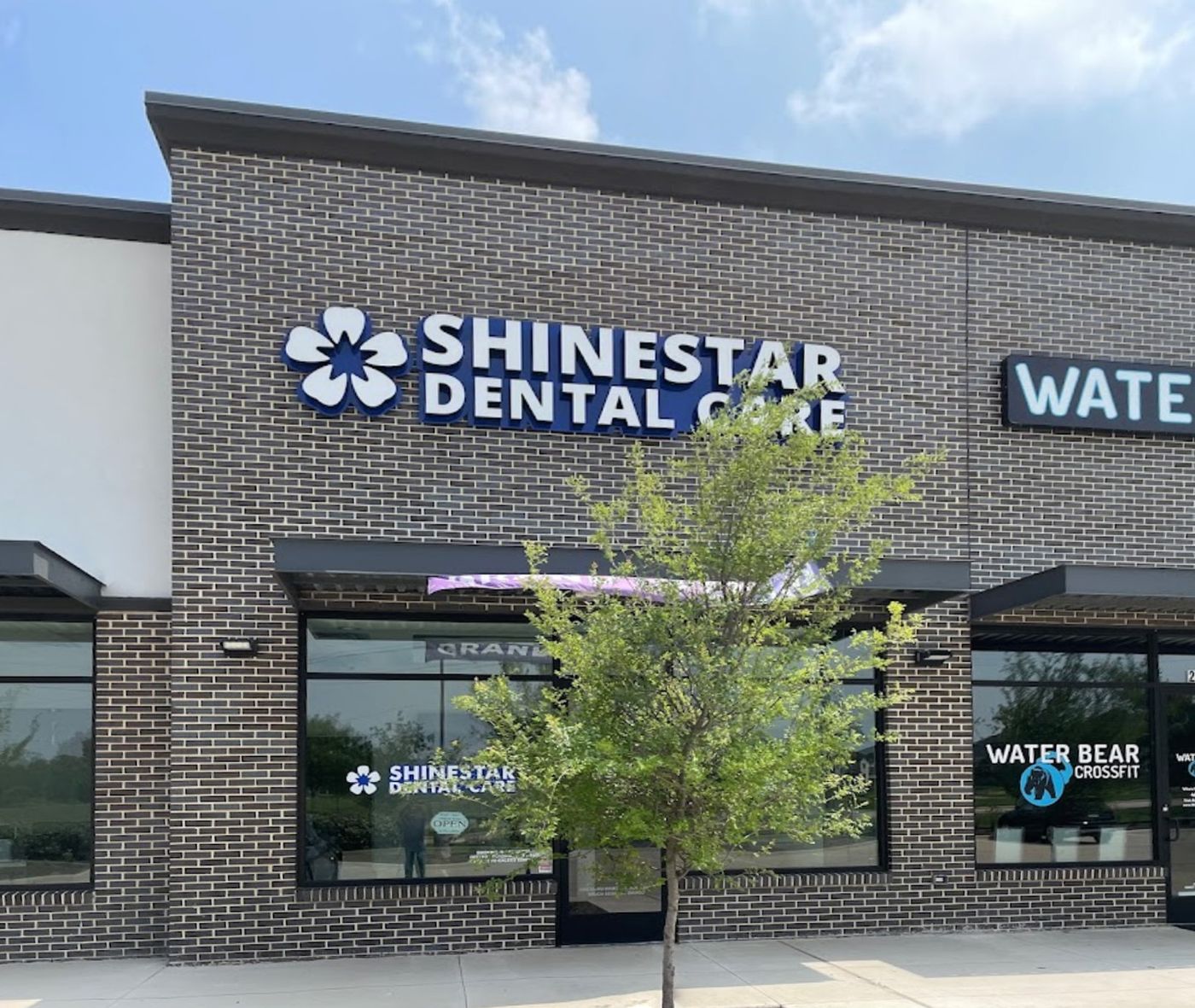 Storefront with the Shinestar Dental Care sign in Frisco, TX