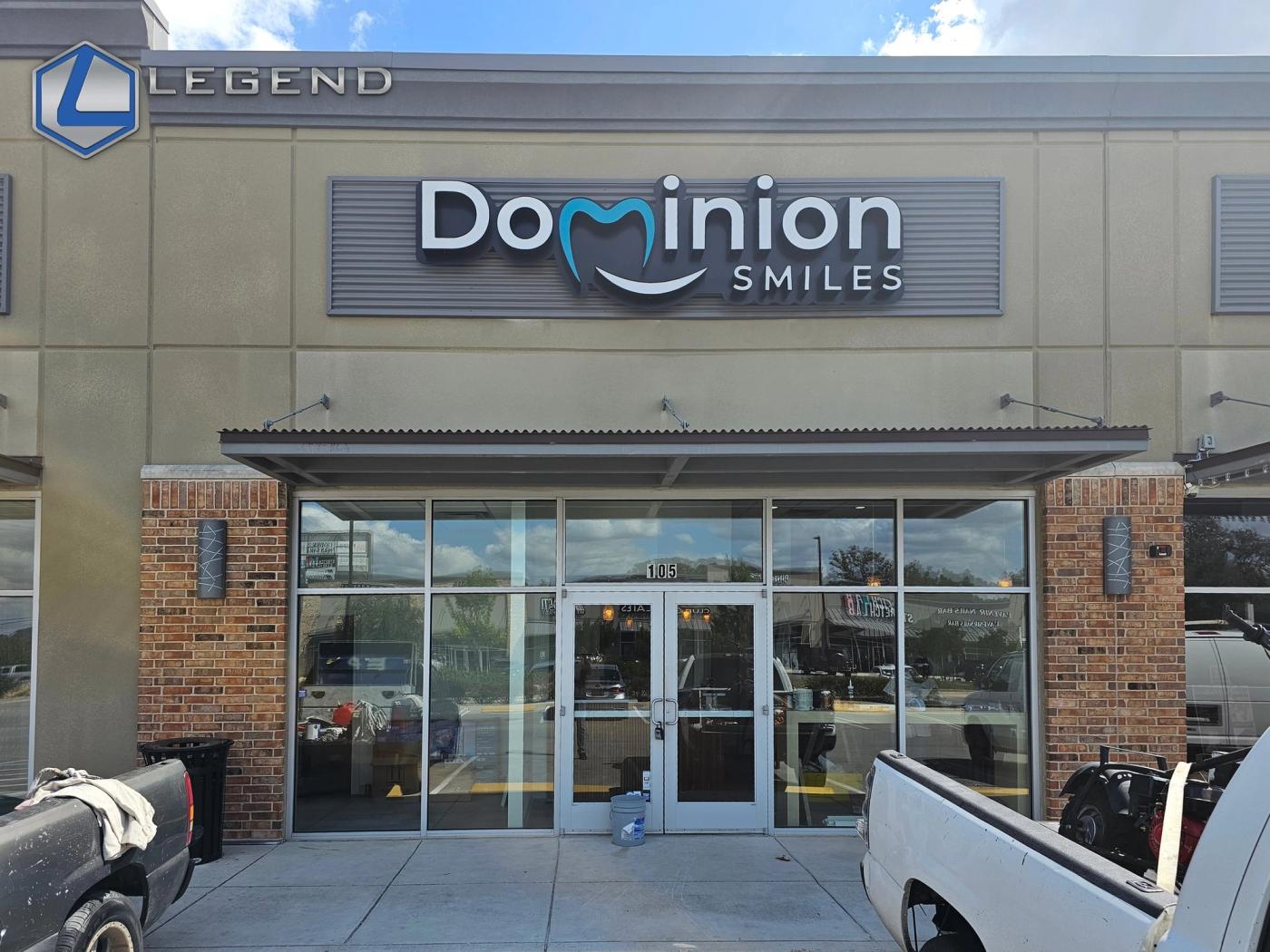 Storefront with the Dominion Smiles sign above glass doors, Dominion Smiles, San Antonio, TX