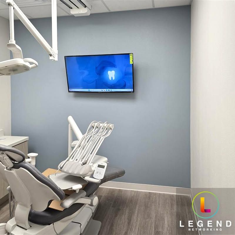 Dental chair and wall-mounted display at Everlasting Dentistry during setup.