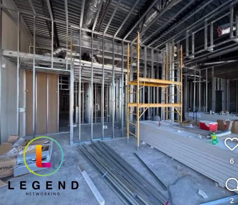 Metal stud framing, ductwork and scaffolding during construction at Thriving Smiles Dental in Spring