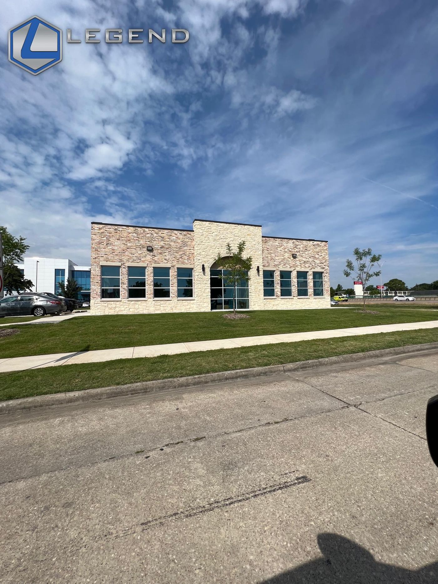 Brick and stone exterior of the Tiny Teeth Pediatric Dentistry building in Mesquite, TX