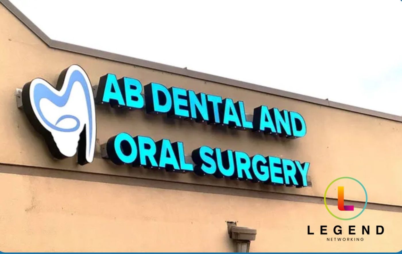 Illuminated AB Dental and Oral Surgery sign on the practice building, AB Dental and Oral Surgery, San Antonio, TX