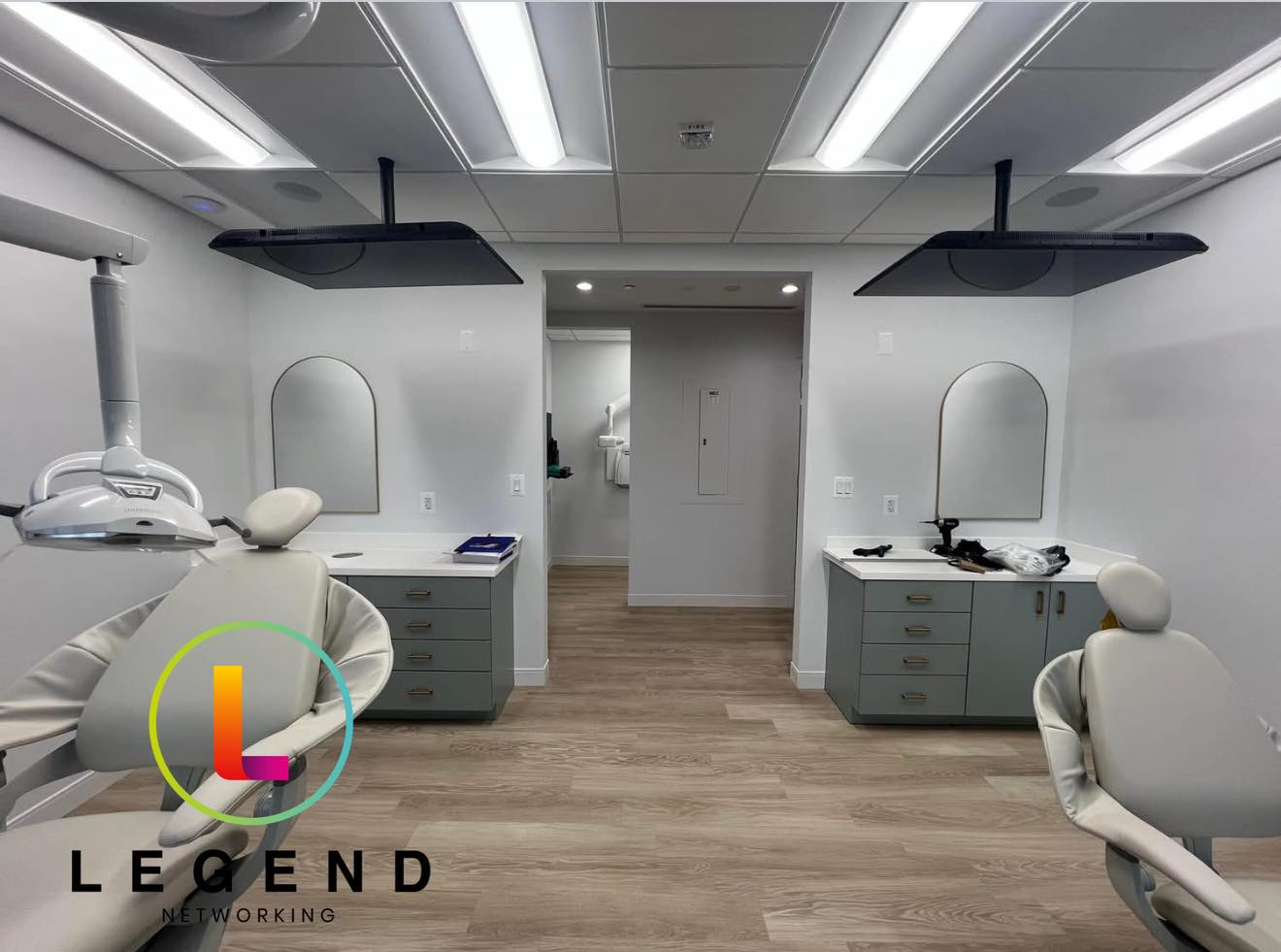 Open treatment bay with two dental chairs and ceiling-mounted monitors at Olney Pediatric Dentistry in Olney, MD