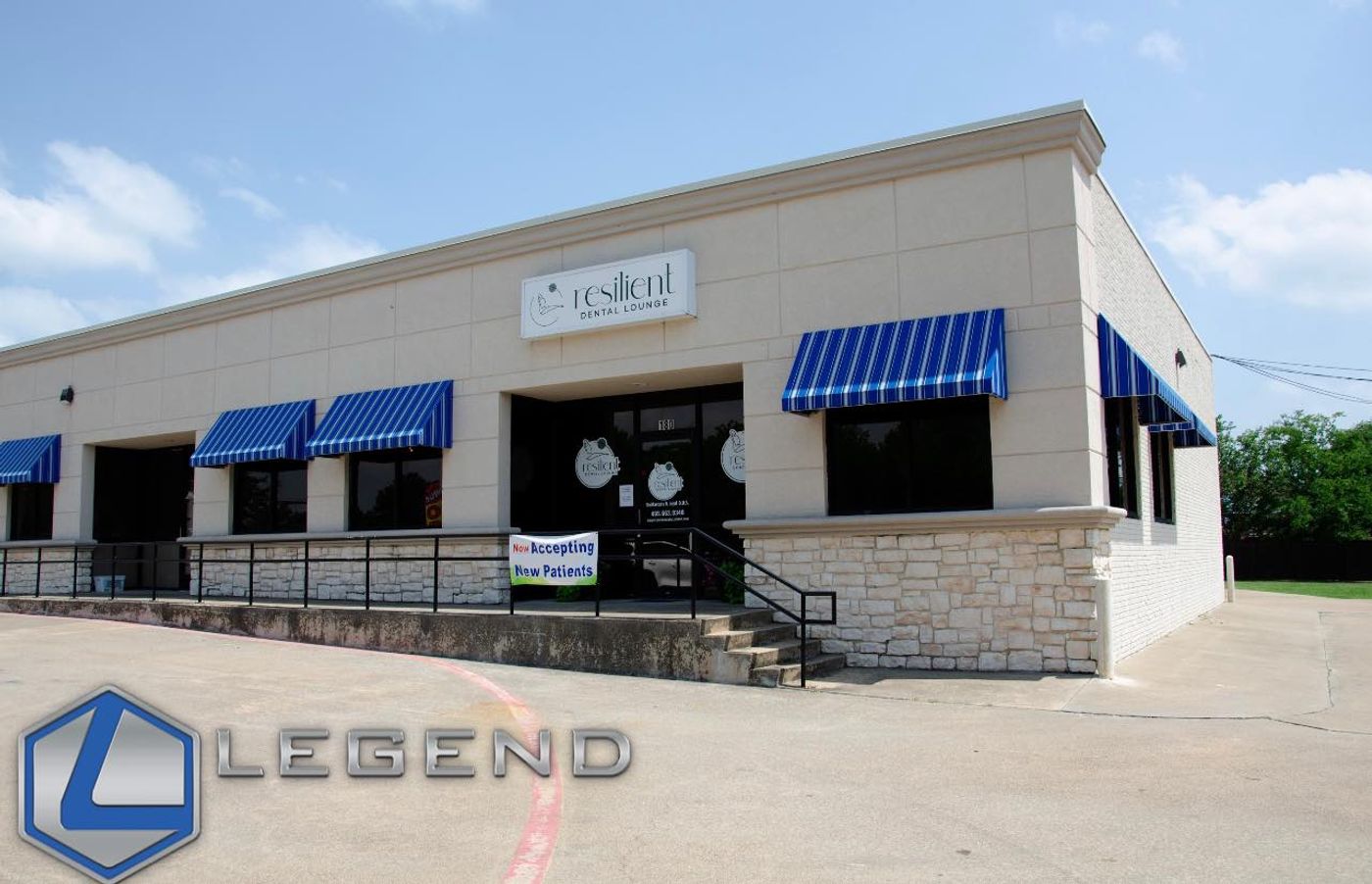 Single-story building exterior with blue awnings and Resilient Dental Lounge sign at Resilient Dental Lounge, Wylie, TX