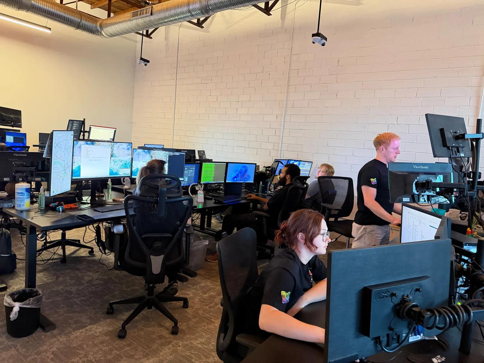 Legend Networking engineers working at the Dallas headquarters support floor.