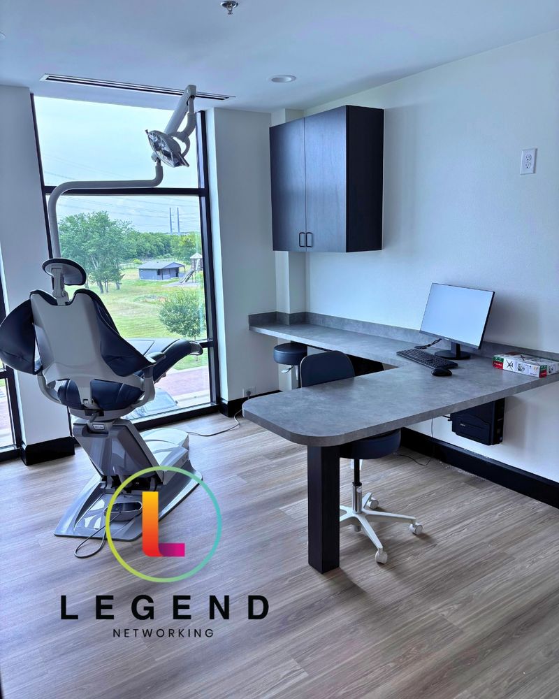 Treatment room with dental chair and workstation at Trinity Valley Oral Surgery & Dental Implant Center in Fate