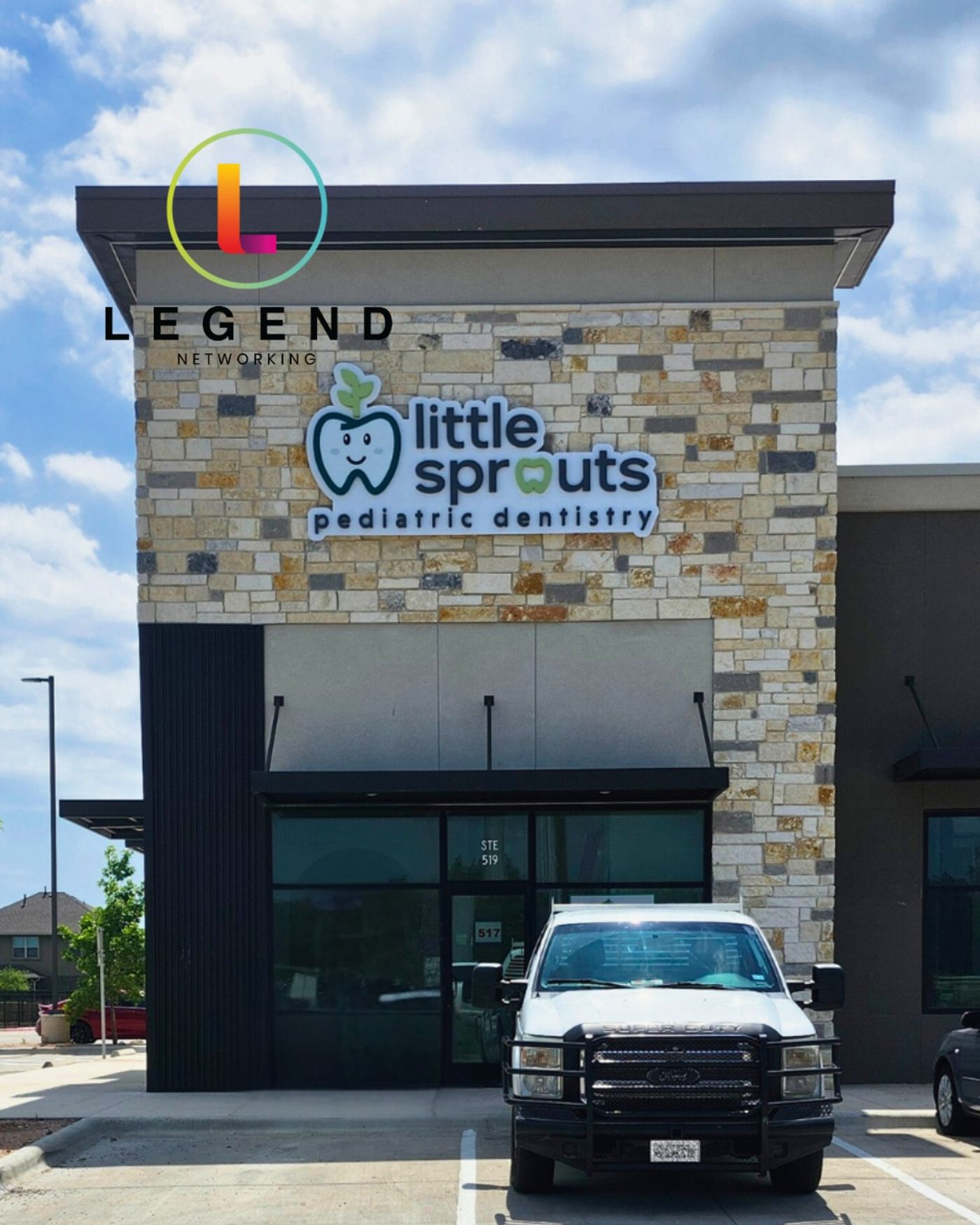 Storefront with the Little Sprouts Pediatric Dentistry sign on a stone facade in Leander, TX