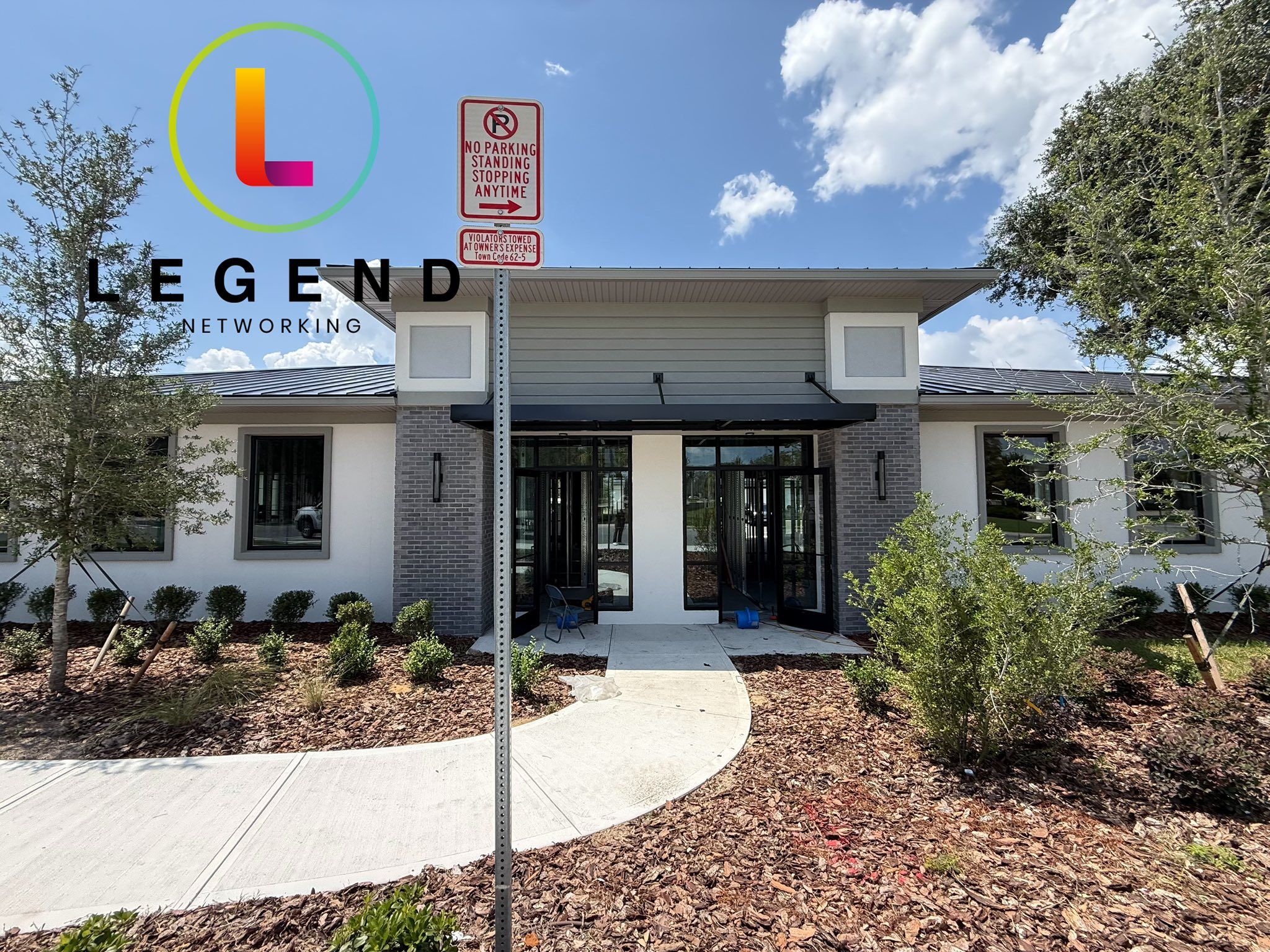 Exterior and front entrance of the new West Orange Dental Studio building in Oakland, FL