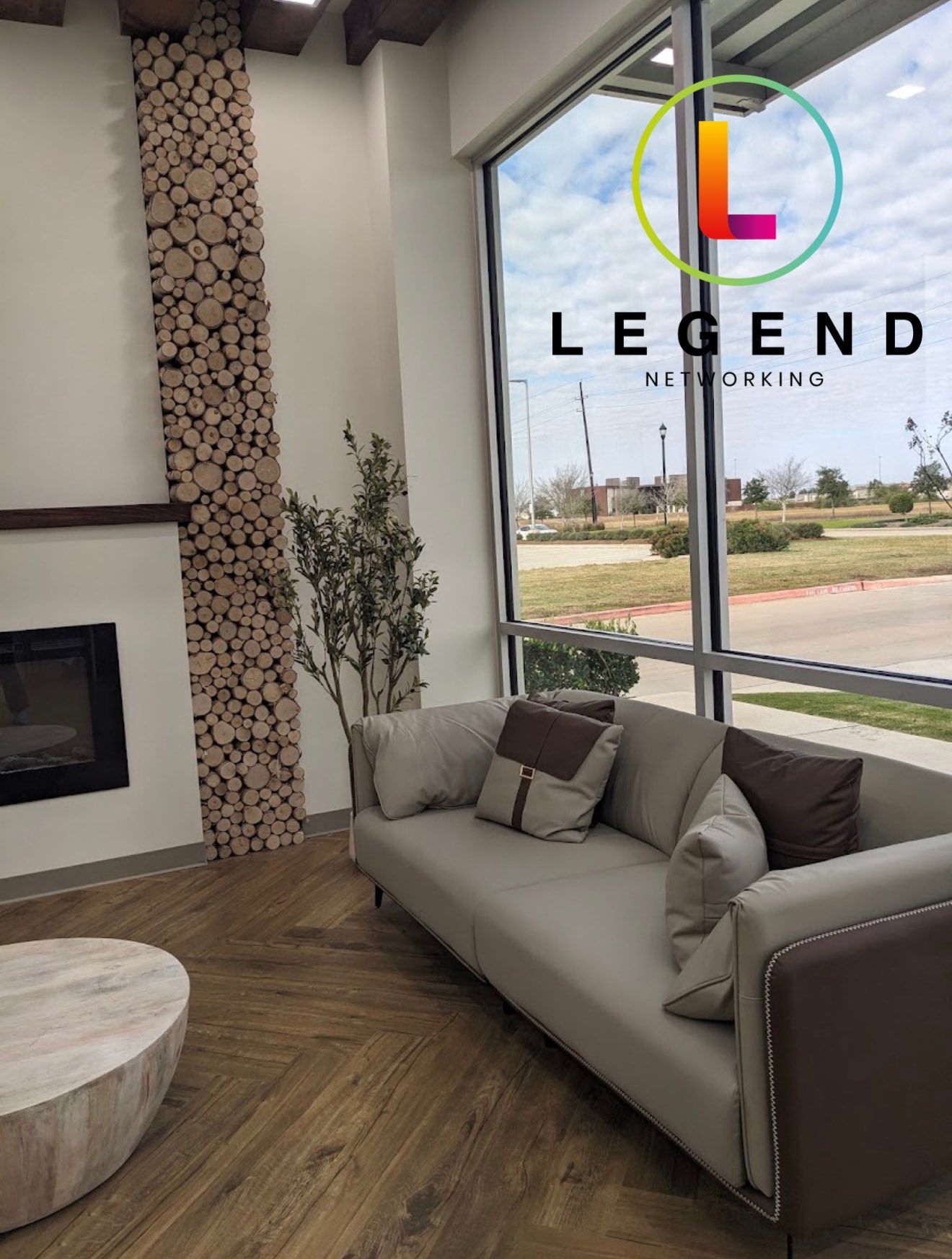 Waiting area with sofa and wood-slice feature wall at Triple Oak Dental & Wellness in Katy