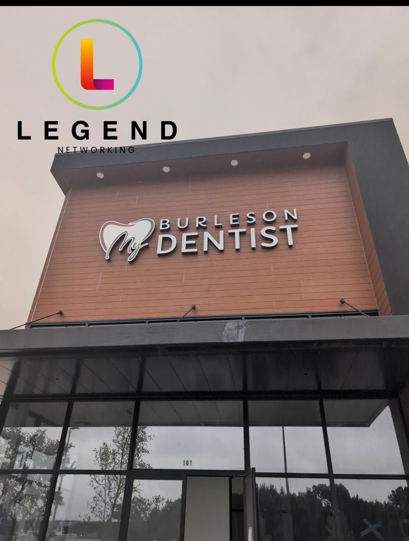 Building facade with the Burleson Dentist sign above the glass entrance of My Burleson Dentist in Burleson, TX