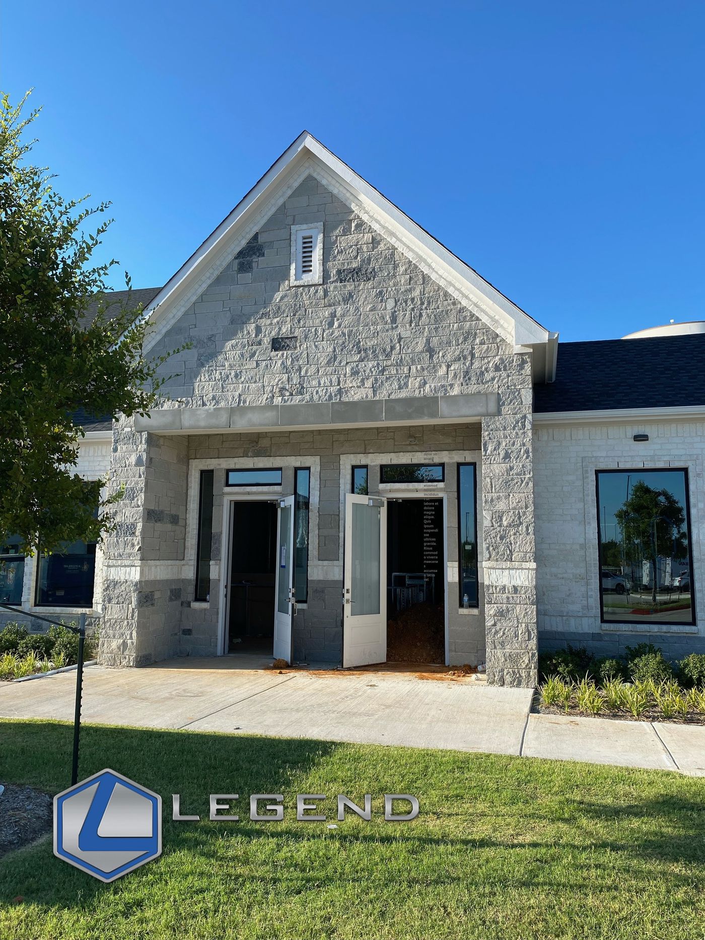 Stone-front entrance of the Buchwald Orthodontics building in Prosper, TX