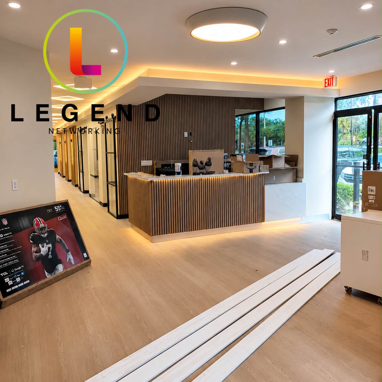 Reception desk and hallway during technology installation at Goodshine Dental in Fort Lauderdale