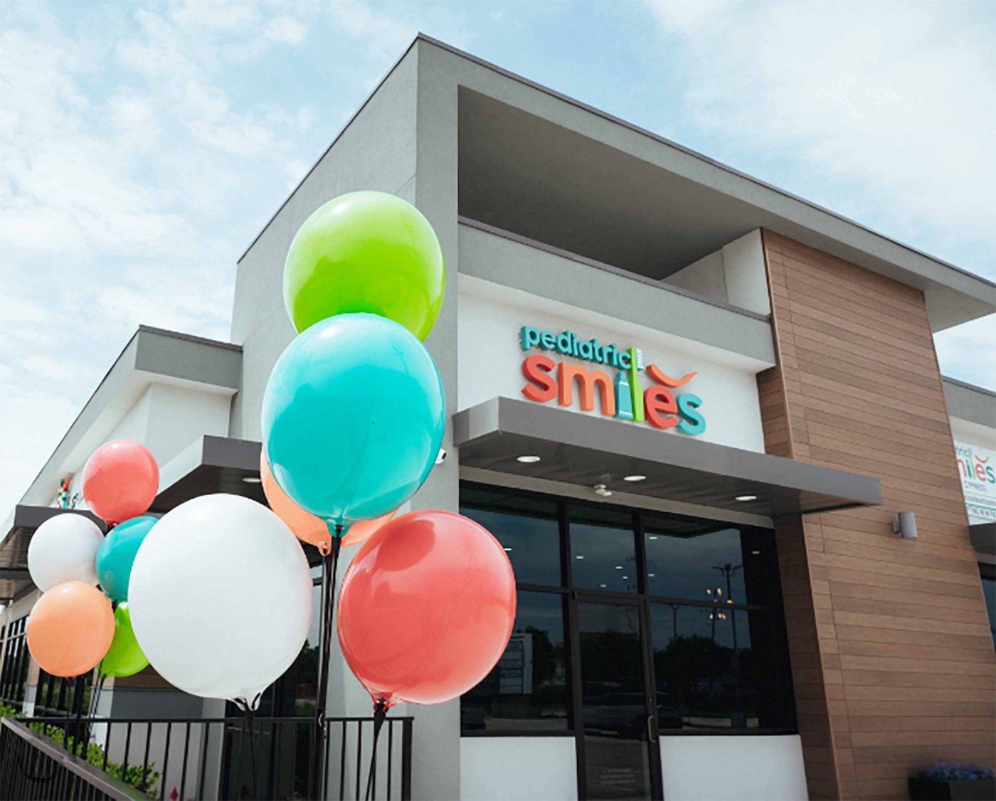 Pediatric Smiles storefront with balloons at the entrance in Cypress, TX