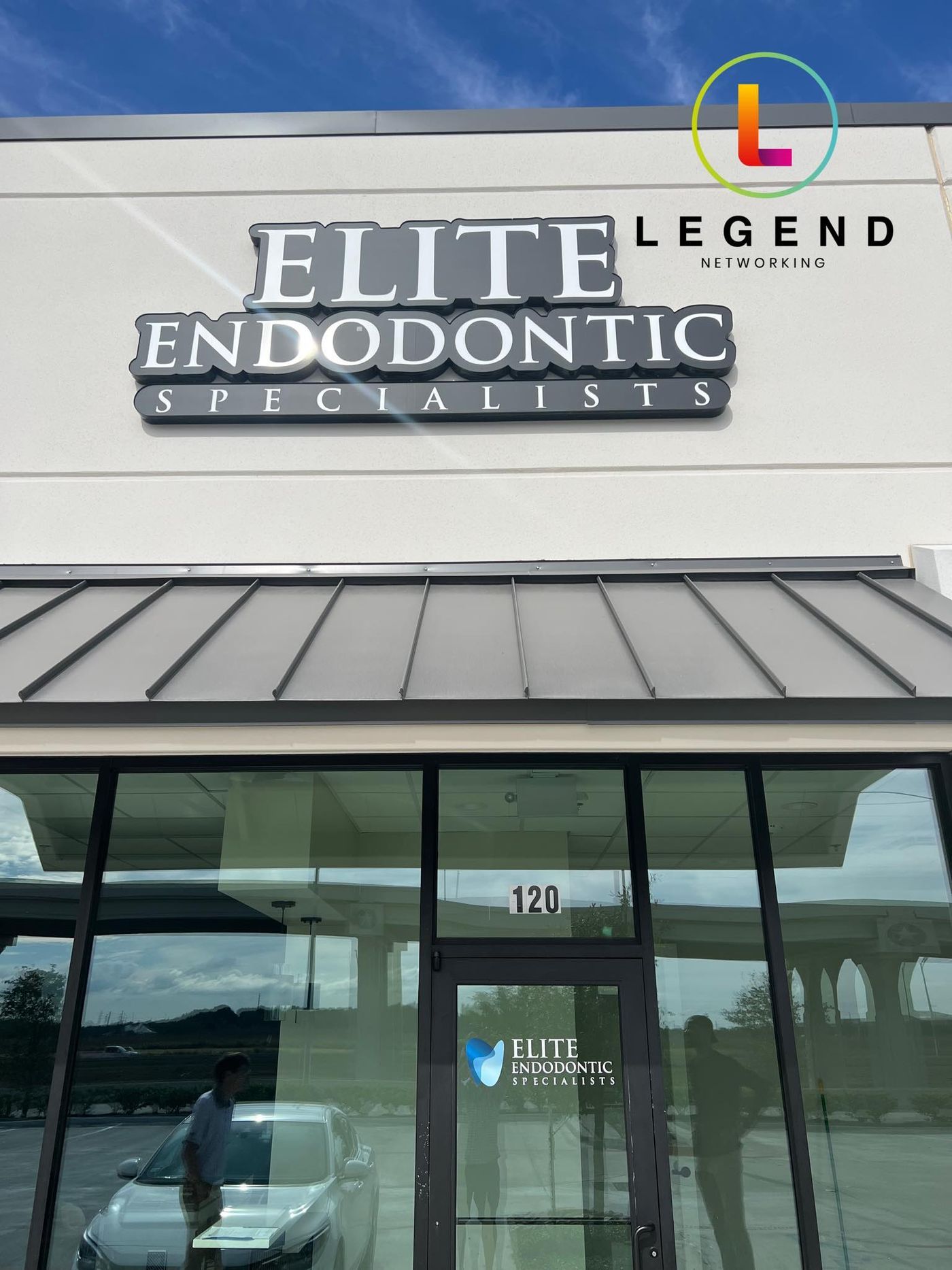 Exterior sign and glass entrance of Elite Endodontic Specialists in Missouri City, TX