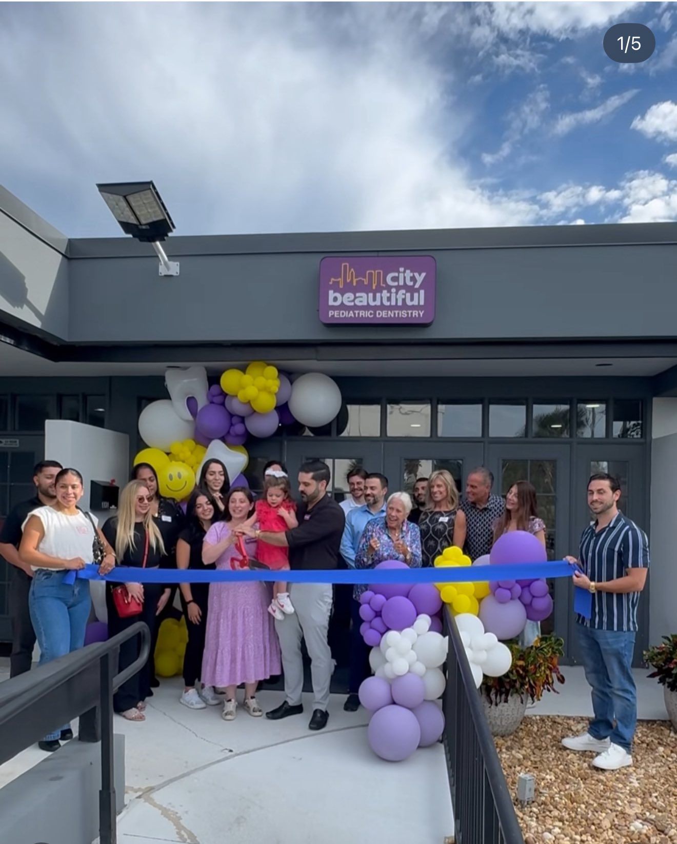 Ribbon cutting at the entrance of City Beautiful Pediatric Dentistry in Orlando