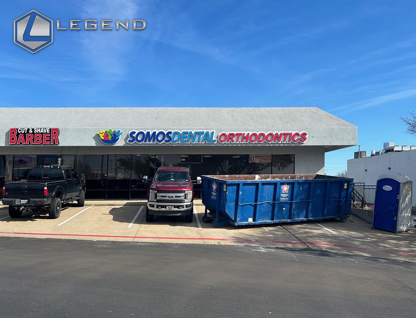 Somos Dental Orthodontics sign on a retail storefront during the buildout, Plano, TX