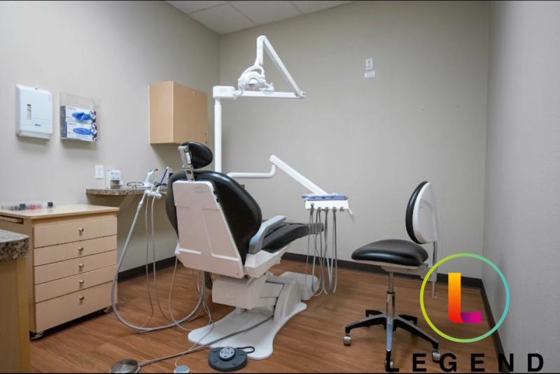 Treatment room with dental chair, delivery unit and cabinetry at AB Dental and Oral Surgery, San Antonio, TX