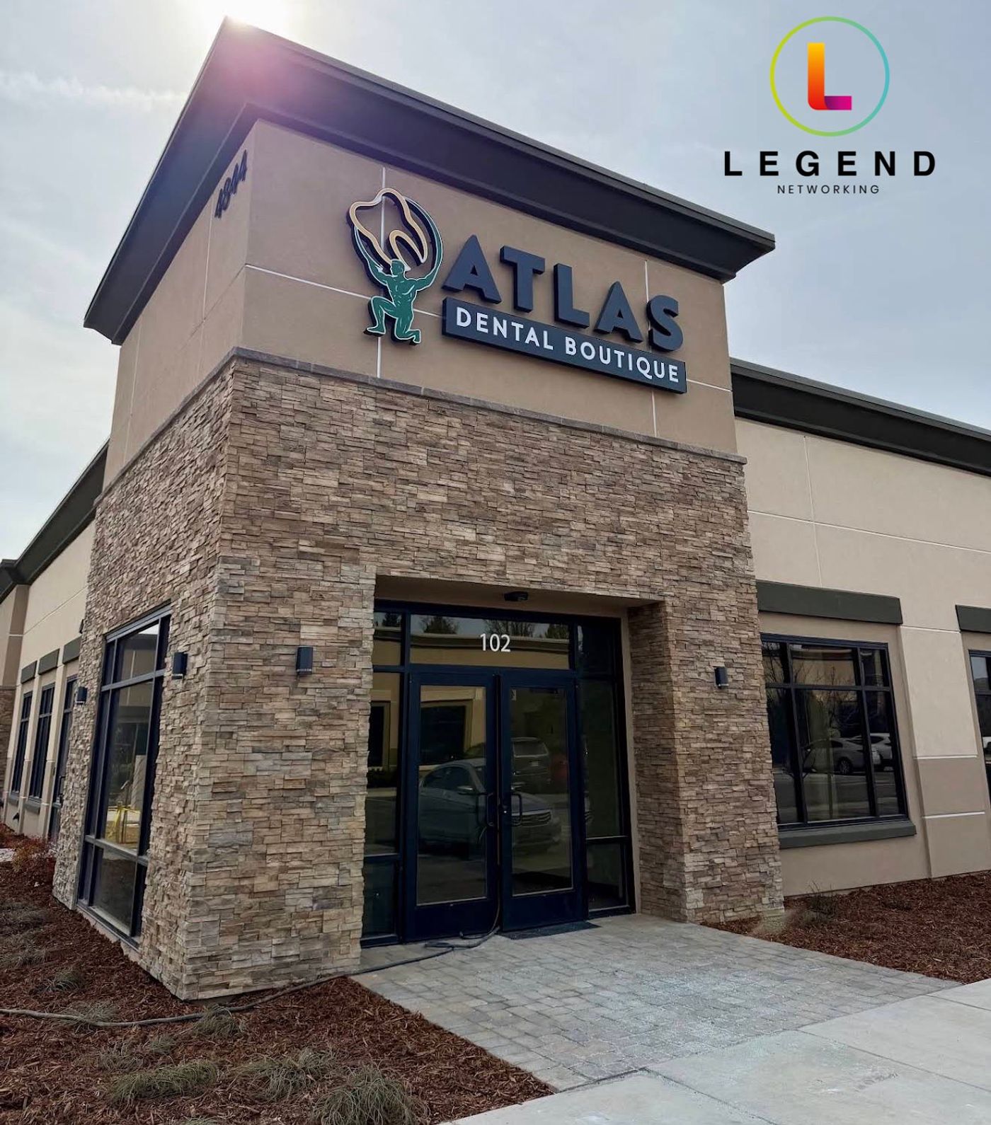 Atlas Dental Boutique stone storefront with the practice sign above the entrance, Sparks, NV