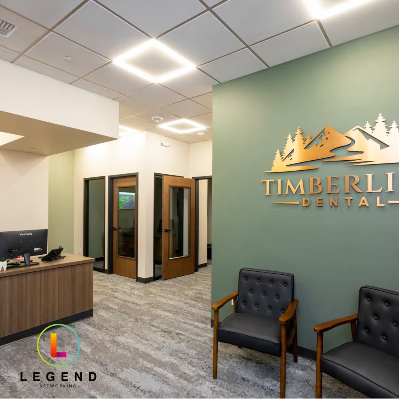 Reception area with front desk, chairs and gold Timberline Dental wall sign, Timberline Dental, Spokane Valley, WA