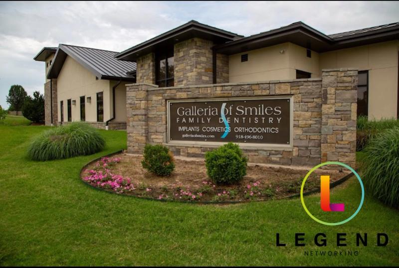 Stone monument sign for Galleria of Smiles Family Dentistry in front of the office in Tulsa, OK