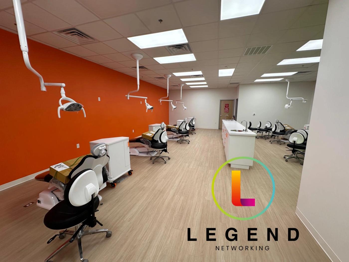 Open treatment bay with dental chairs along an orange wall during setup at Texas Tiny Teeth of Greenville, TX