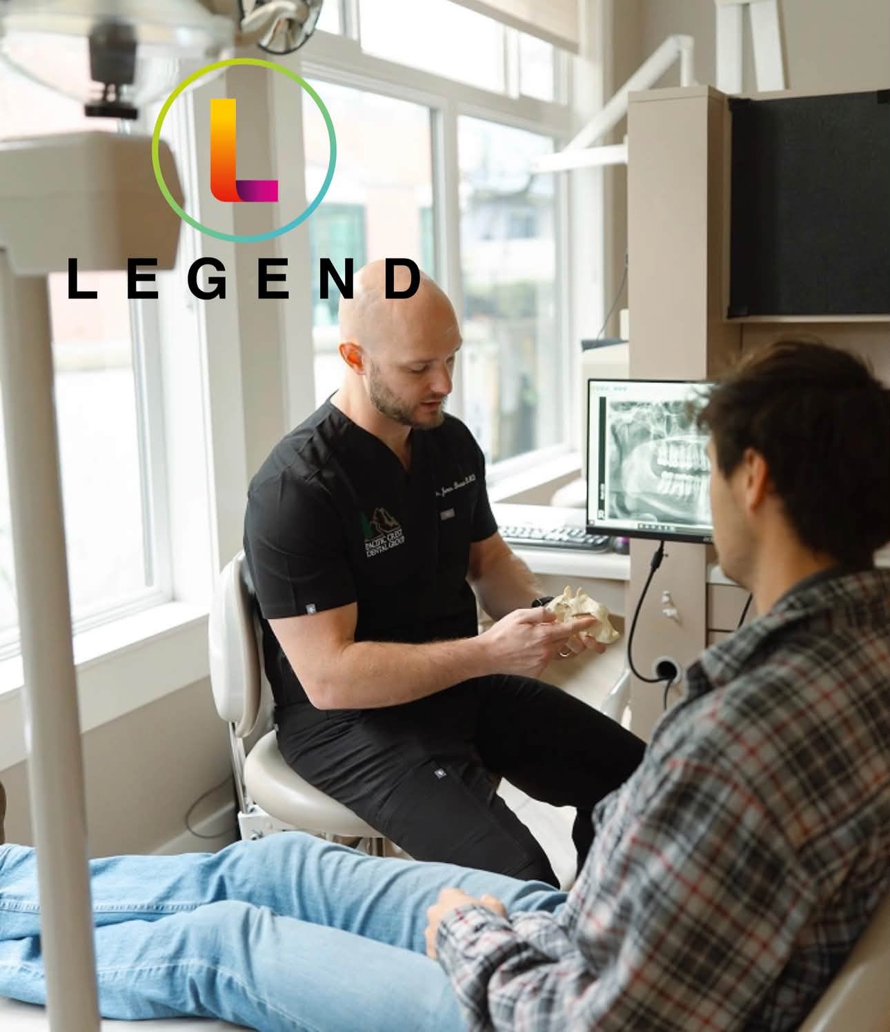 Treatment room with a dentist and patient reviewing an X-ray at Pacific Crest Dental Group in Salem