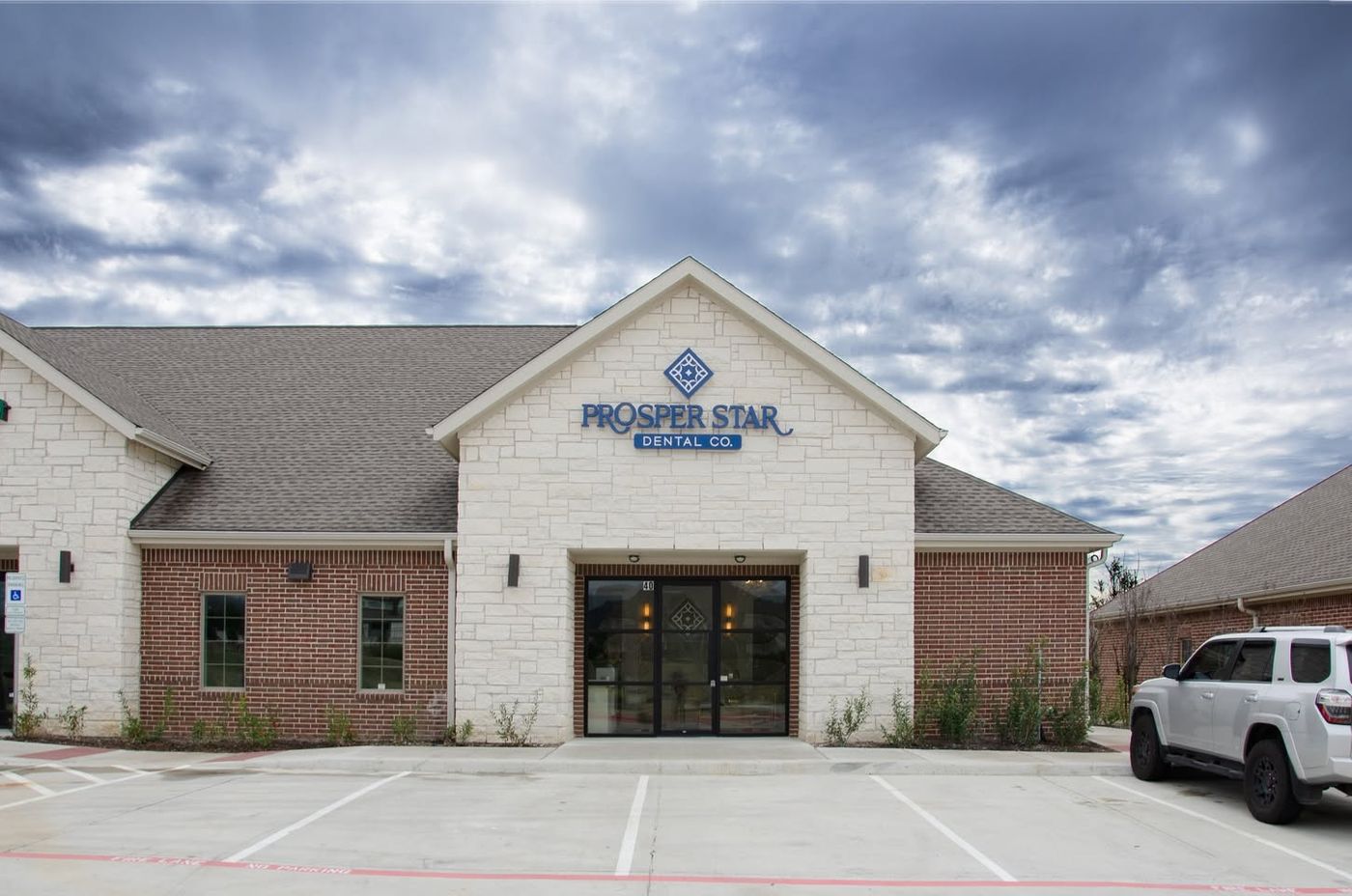Prosper Star Dental Co. exterior and practice sign.