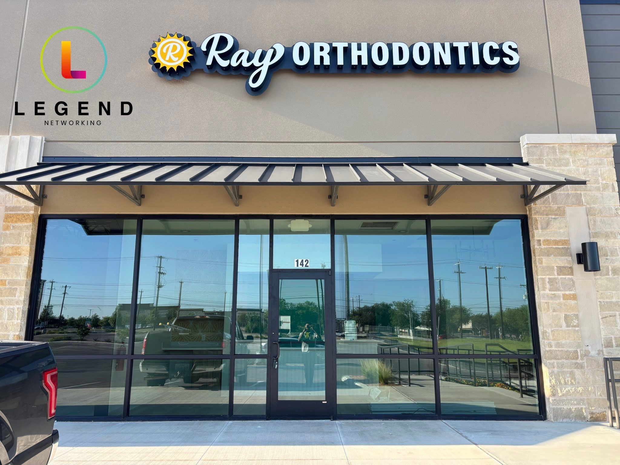 Storefront and sign of Ray Orthodontics on Potranco Road in San Antonio