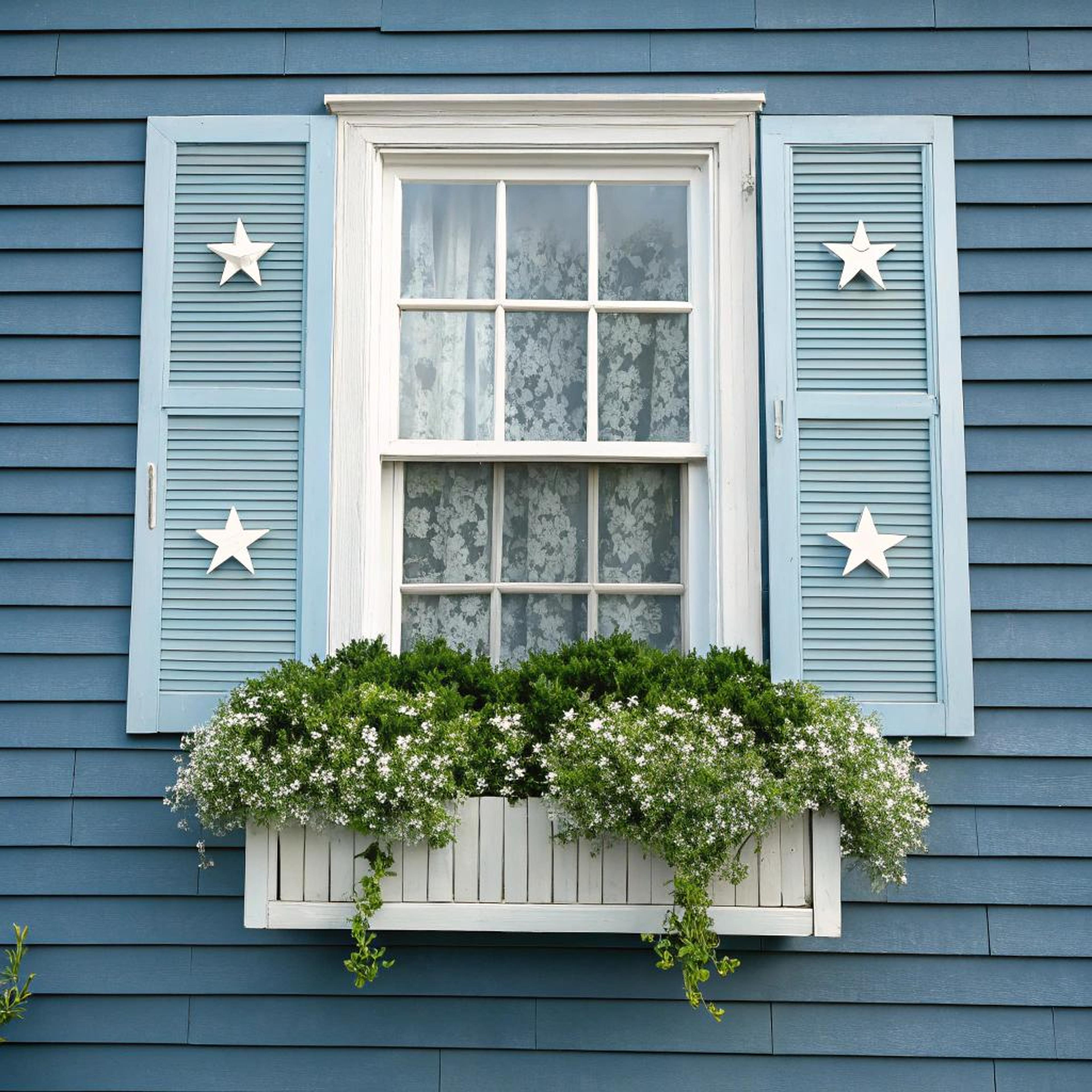 Sterrenmotief op blauwe shutters