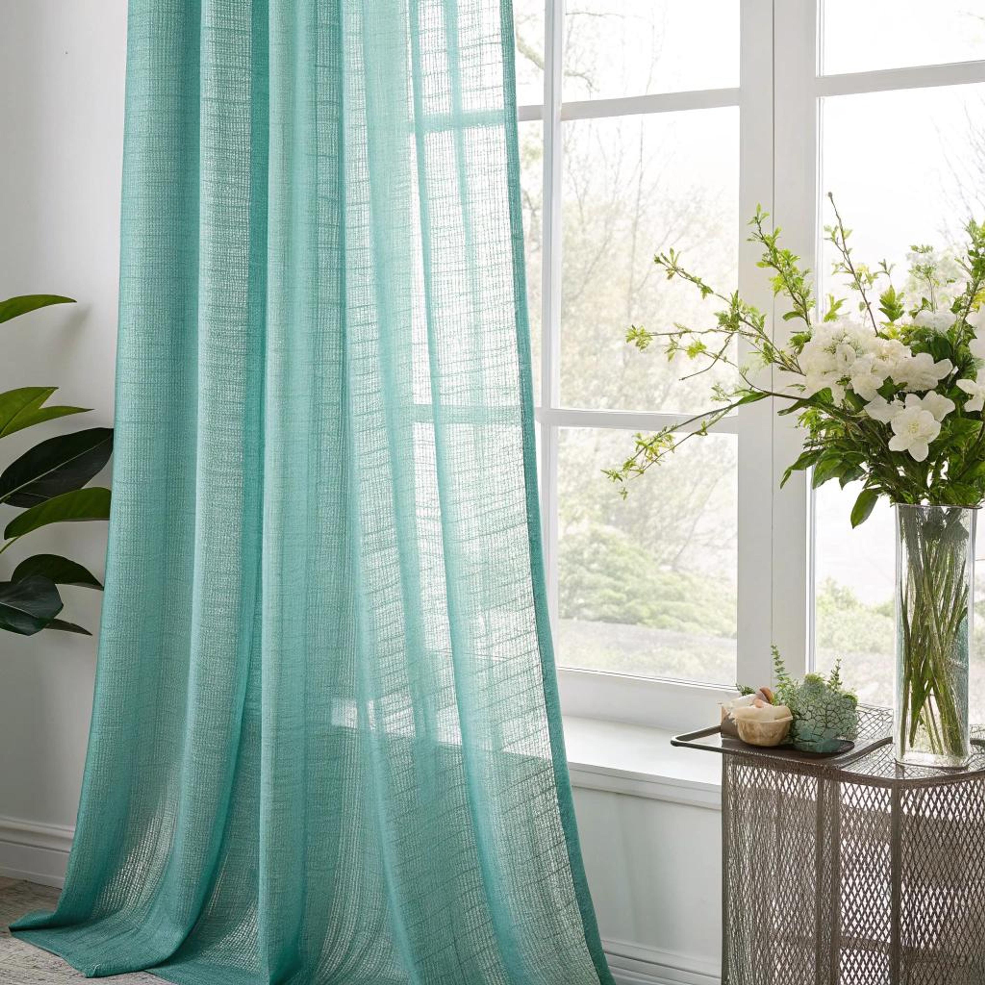 Turquoise gordijn met geweven structuur